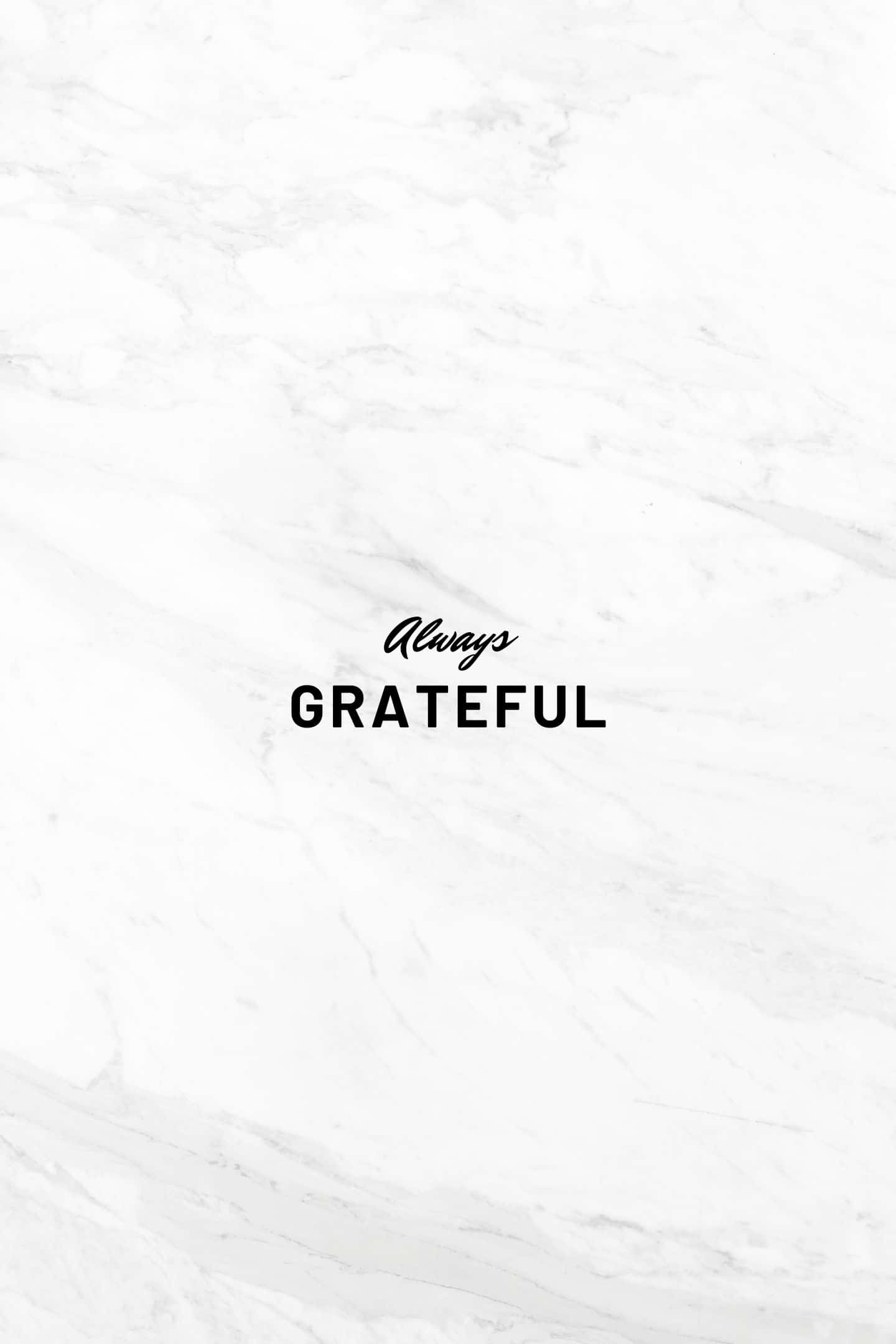 White Marble 桌布 壁紙 — 白色大理石背景，中央以極簡字體呈現優雅黑色文字「Always GRATEFUL」。