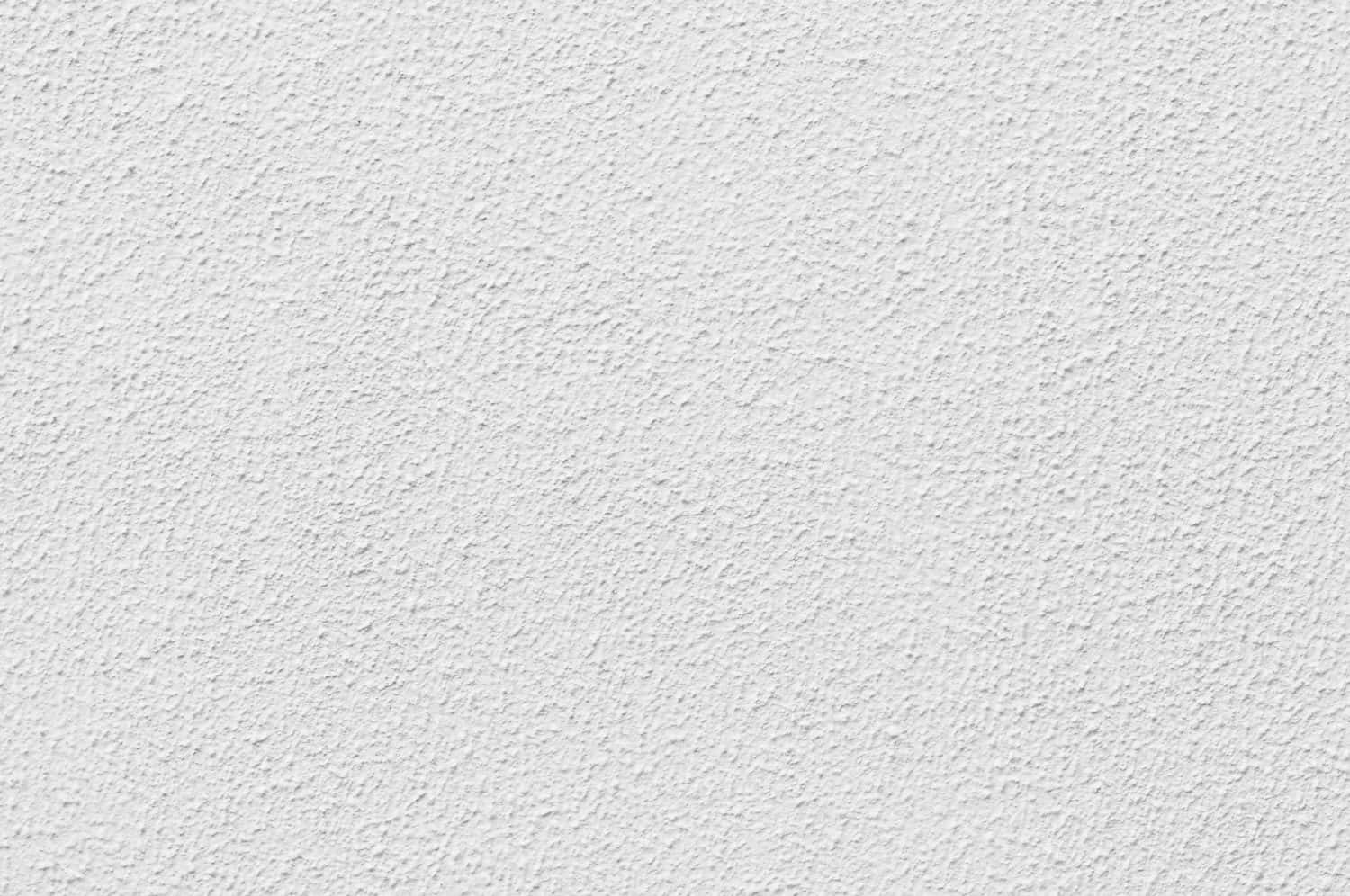 texture 桌布 壁紙 — 白色平滑灰泥牆的特寫，帶有細微紋理和均勻照明。
