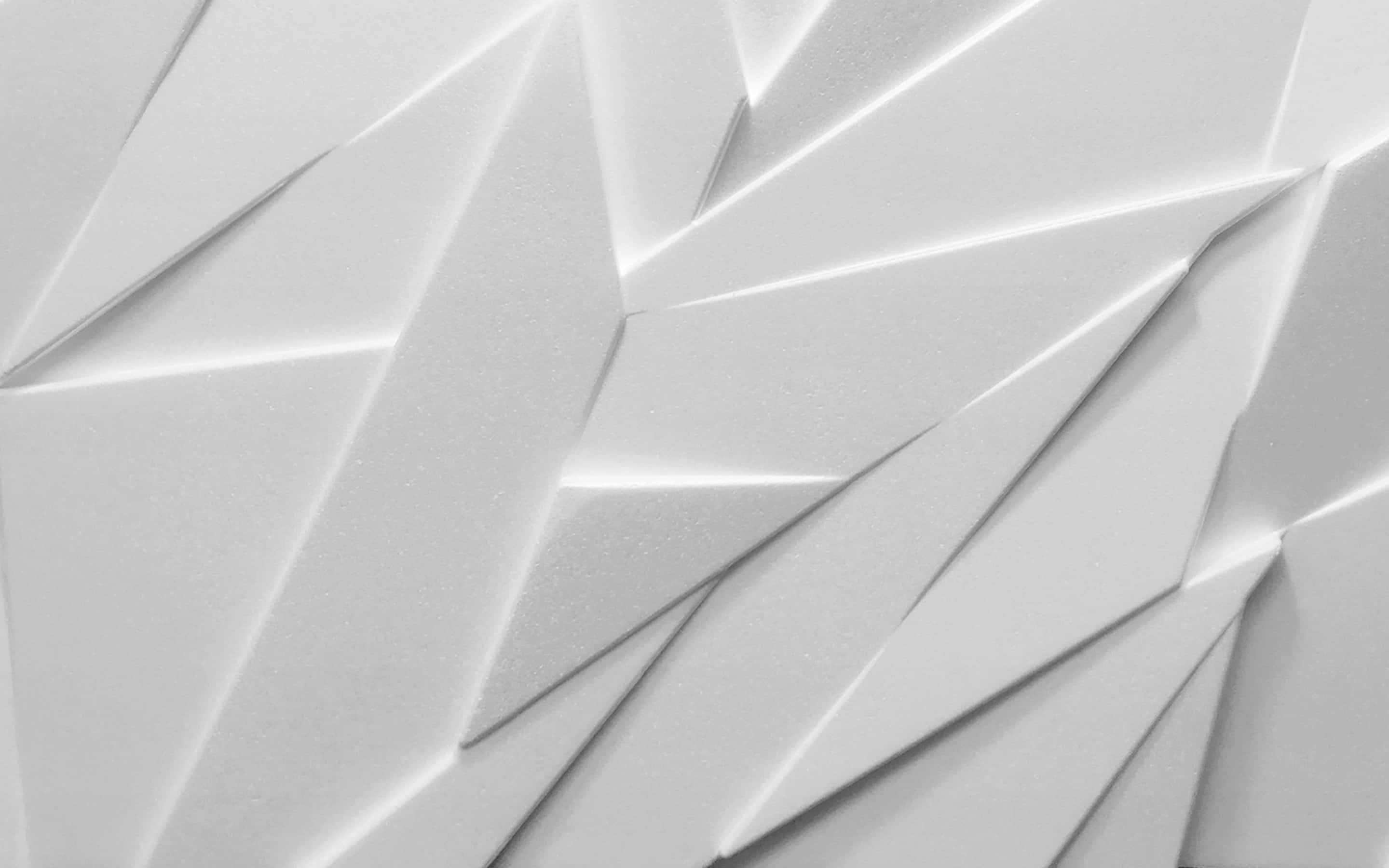 Abstract Design 桌布 壁紙 — 白色幾何牆壁的特寫，具有銳利的角面和平柔的陰影，營造出現代抽象紋理。