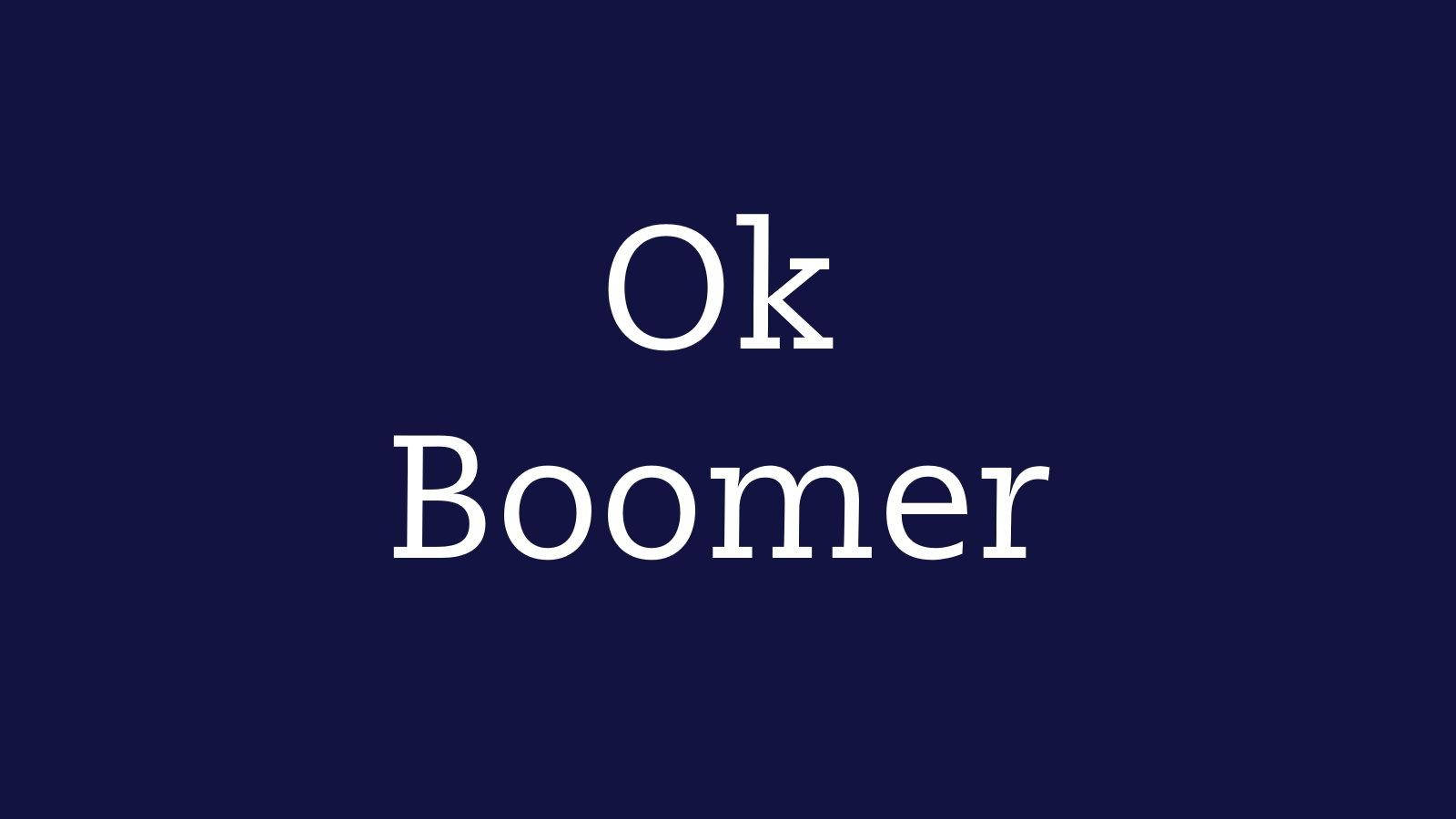 藍色 桌布 壁紙 — 白色文字寫著「Ok Boomer」，居中在純海軍藍背景上。