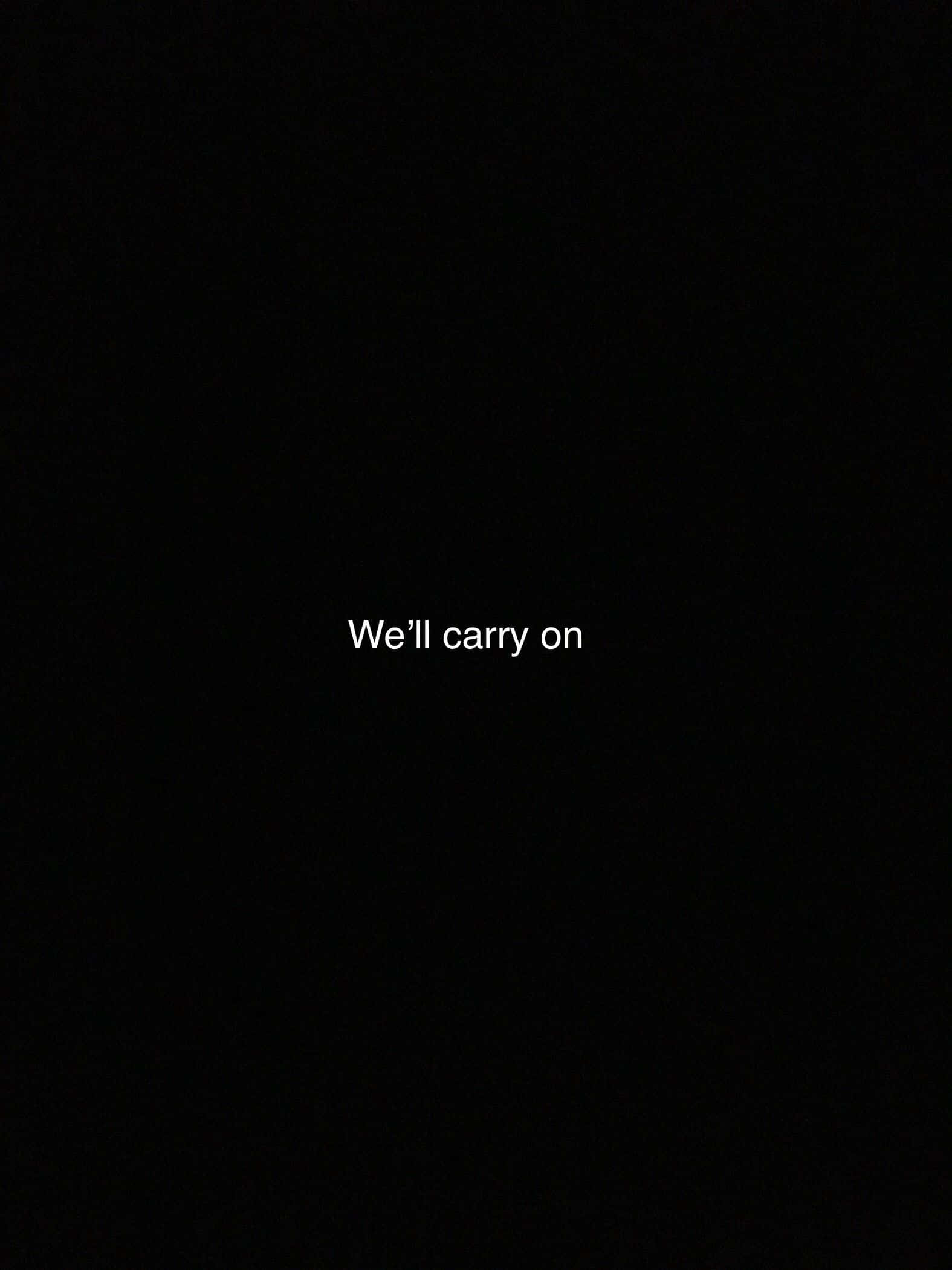 Quote 桌布 壁紙 — 白色文字顯示「We'll carry on」，居中於純黑色背景上。