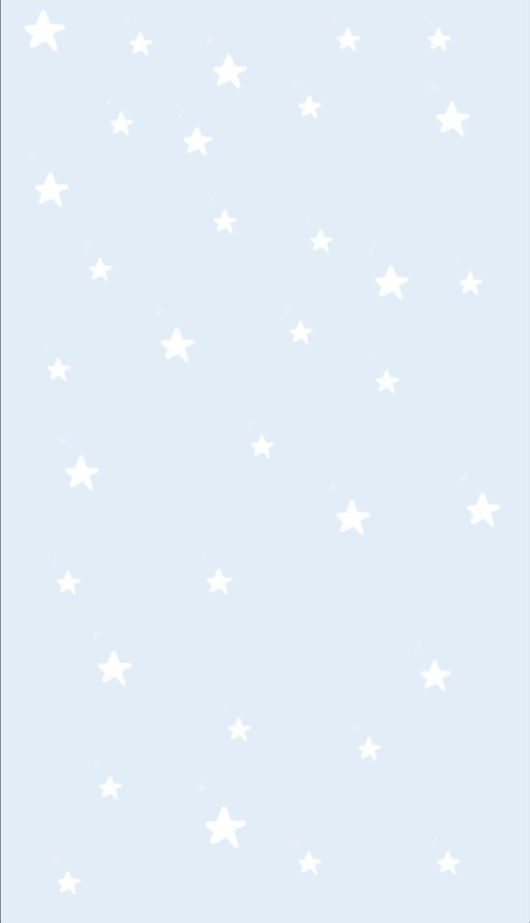 Blue Stars 桌布 壁紙 — 白色星星在柔和粉藍色背景上輕輕飄浮，構成簡約數位桌布。