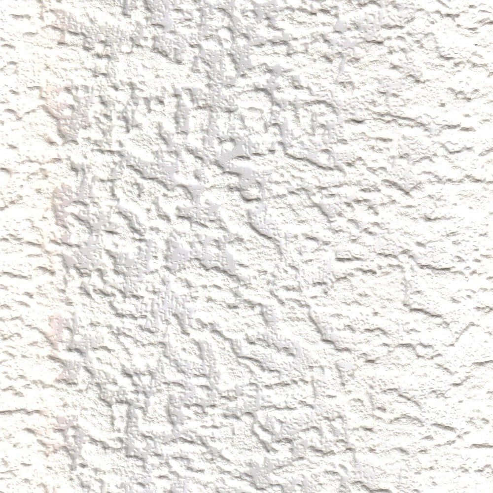 Granite 桌布 壁紙 — 白色灰泥牆的特寫，表面粗糙有紋理，帶有微妙的灰色陰影。