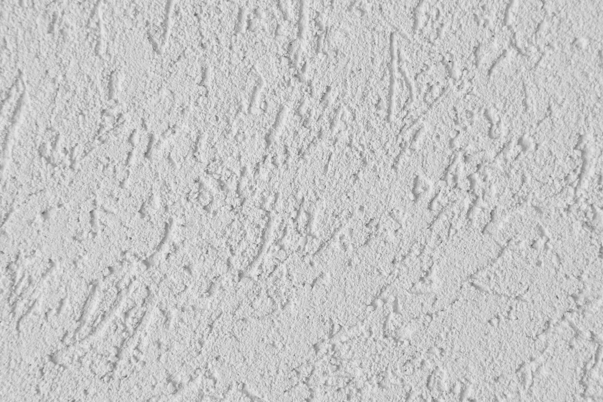 Rough Texture 桌布 壁紙 — 白色灰泥牆的近距離特寫，帶有粗糙紋理圖案和細微陰影。