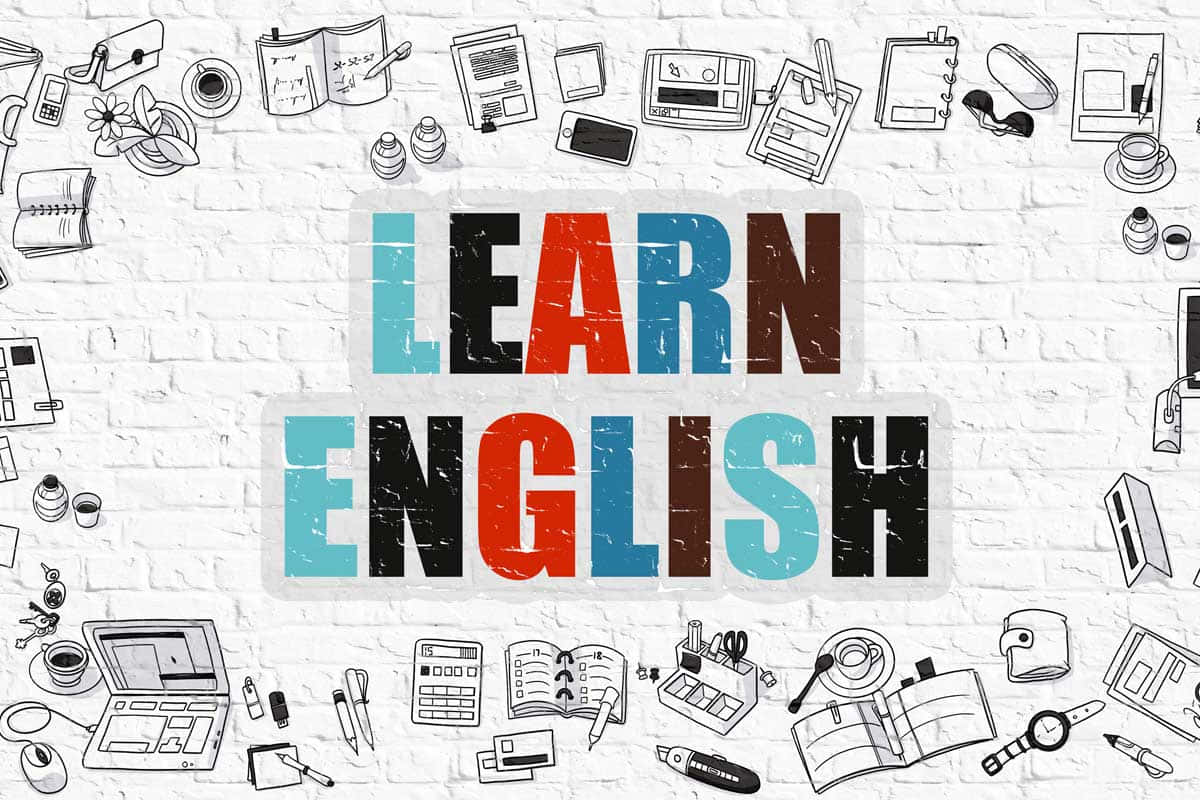 Learning 桌布 壁紙 — 白色磚牆上色彩鮮豔的「學習英語」文字，周圍環繞著黑白學習塗鴉。