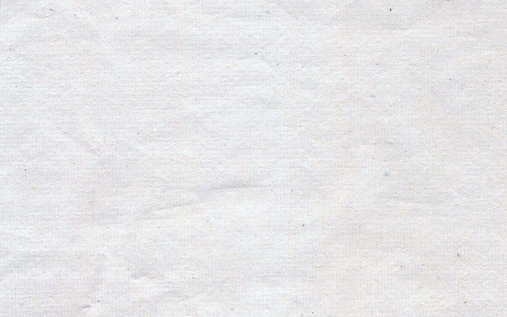 白色 桌布 壁紙 — 白色紋理紙張的特寫，帶有細微的摺痕和隱約的斑點，營造出柔和的有機表面。