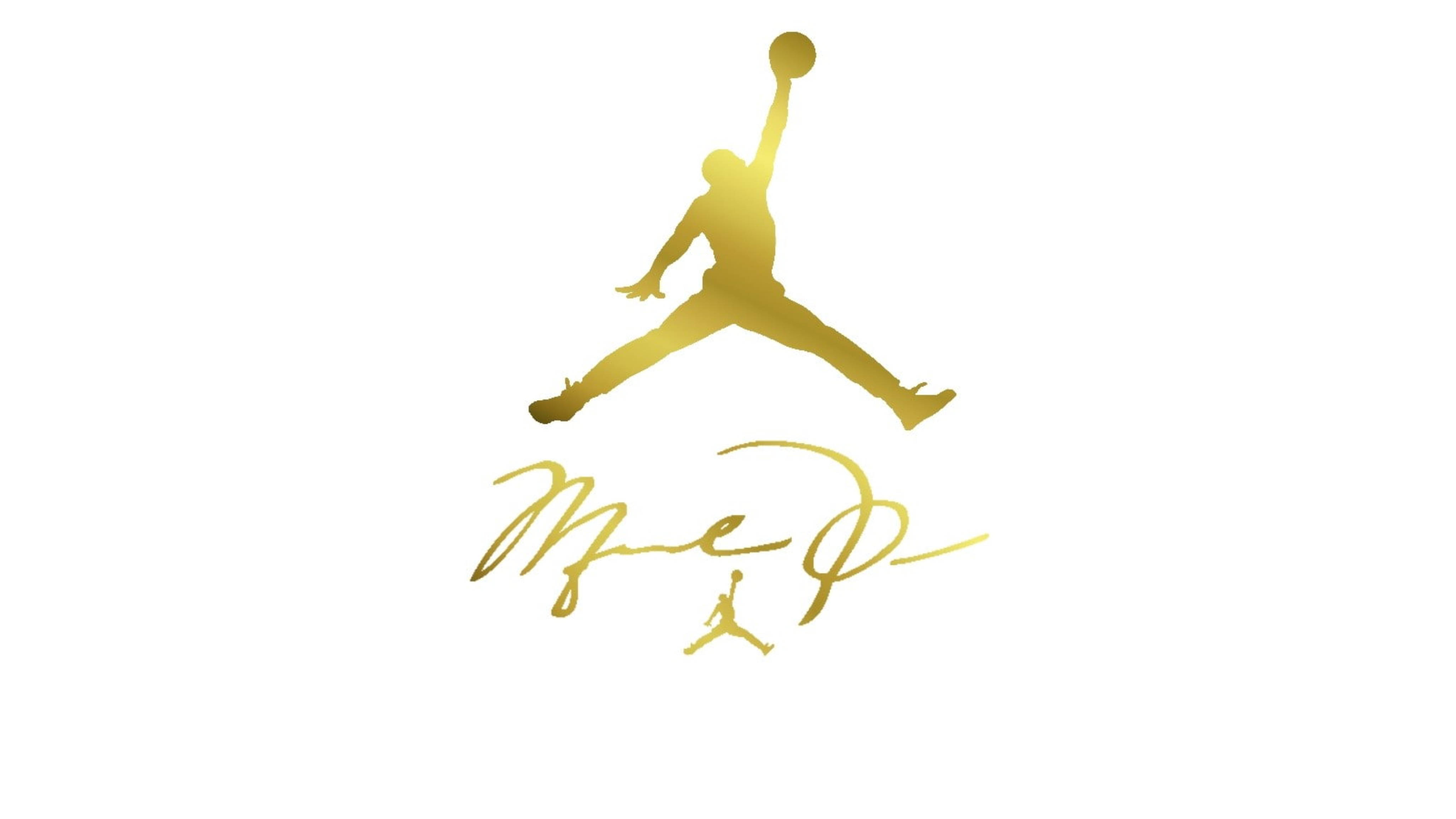 Air Jordan 桌布 壁紙 — 白色背景上，一個籃球運動員在空中灌籃的金色剪影，下方有簽名。