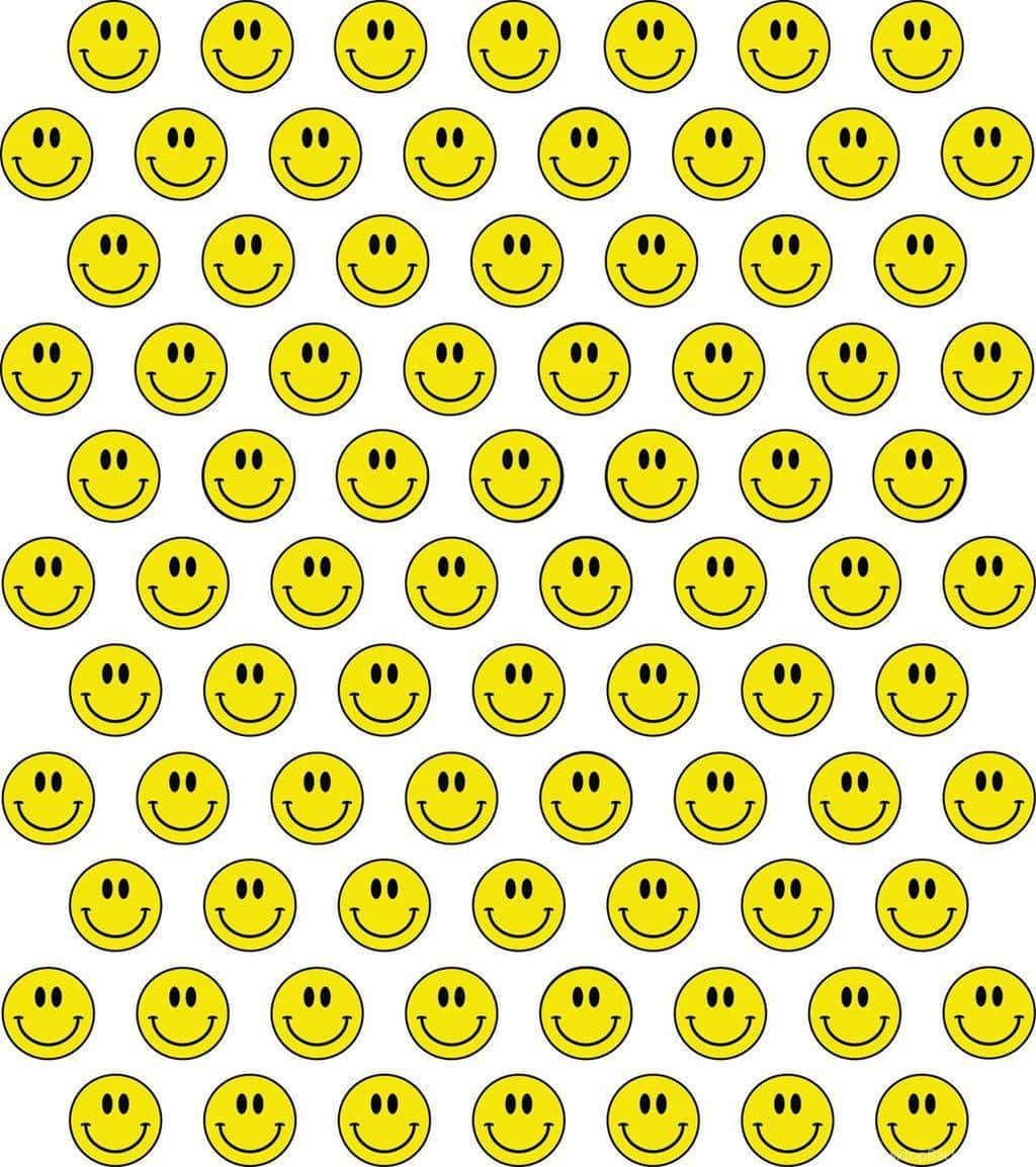 Aesthetic Smiley Face 桌布 壁紙 — 白色背景上，由相同的亮黃色笑臉、黑色輪廓和簡單特徵組成的網格。