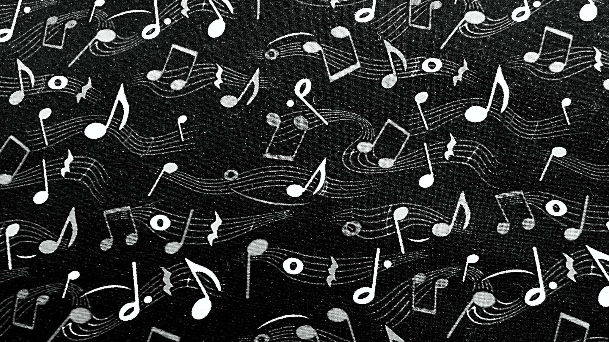 音樂 桌布 壁紙 — 白色音符和五線譜在紋理黑色背景上動態漂浮。