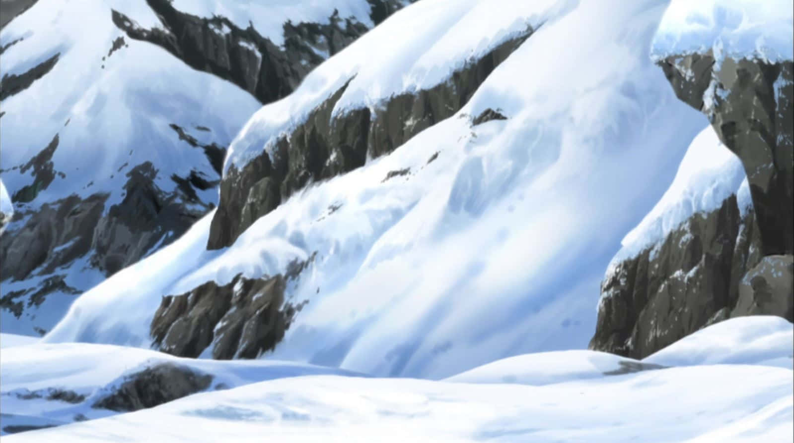 Snowy Mountain 桌布 壁紙 — 白雪覆蓋著崎嶇的山峰和岩石斜坡，在清澈的冬日天空下。