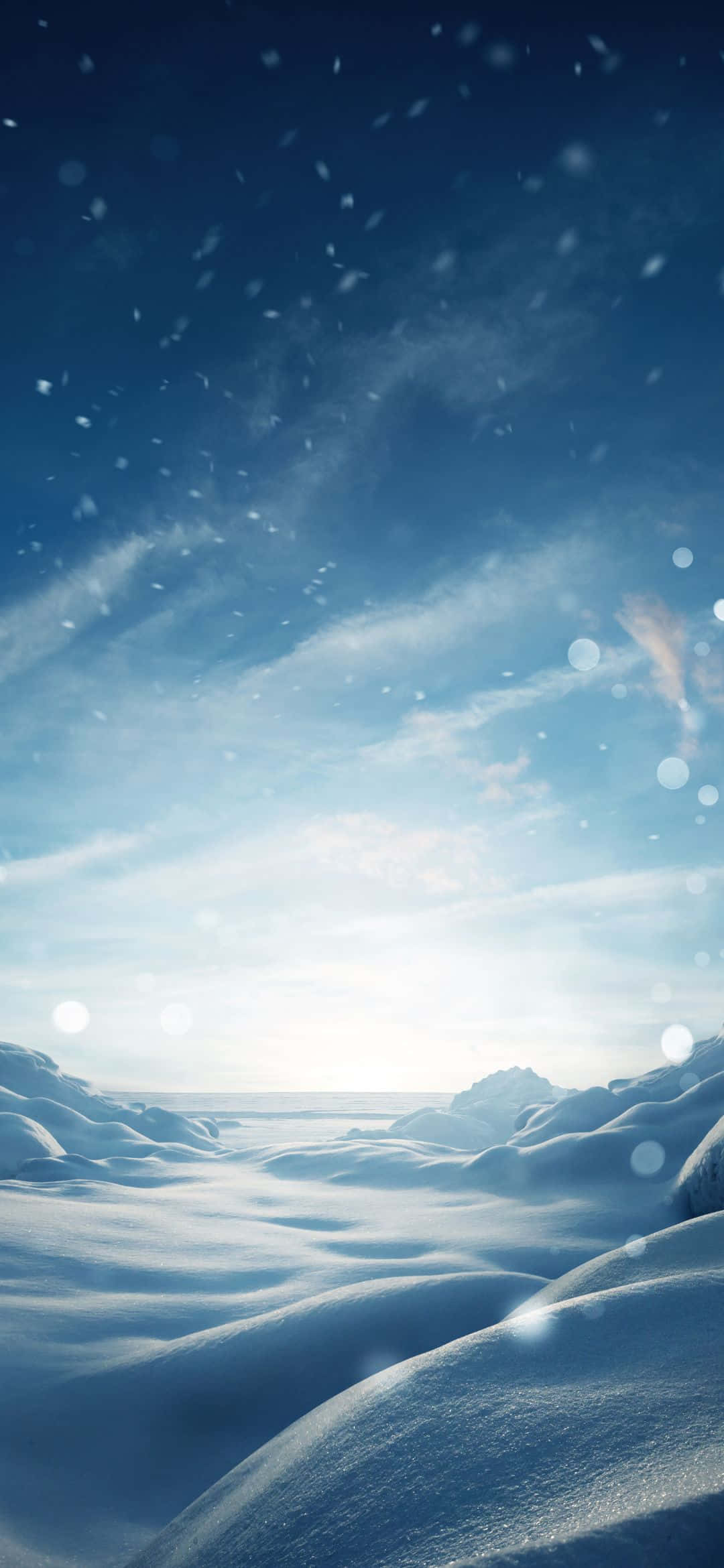 1080x2340 桌布 壁紙 — 白雪覆蓋著起伏的冰凍地形，廣闊的藍天下飄著雪花和柔和鏡頭光暈。