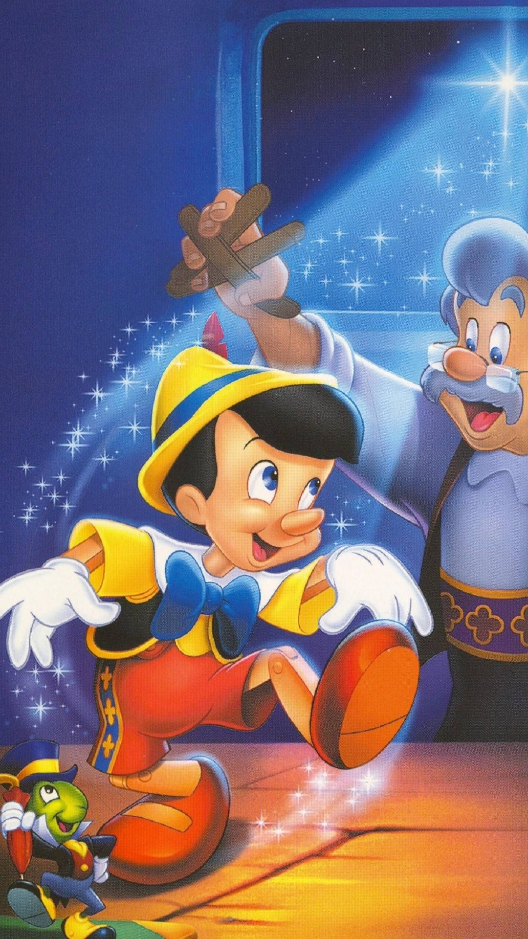 Pinocchio 桌布 壁紙 — 皮諾丘快樂地跳躍，蓋比特在他身後微笑，背景是星光閃爍的藍色天空，充滿閃爍的魔法。