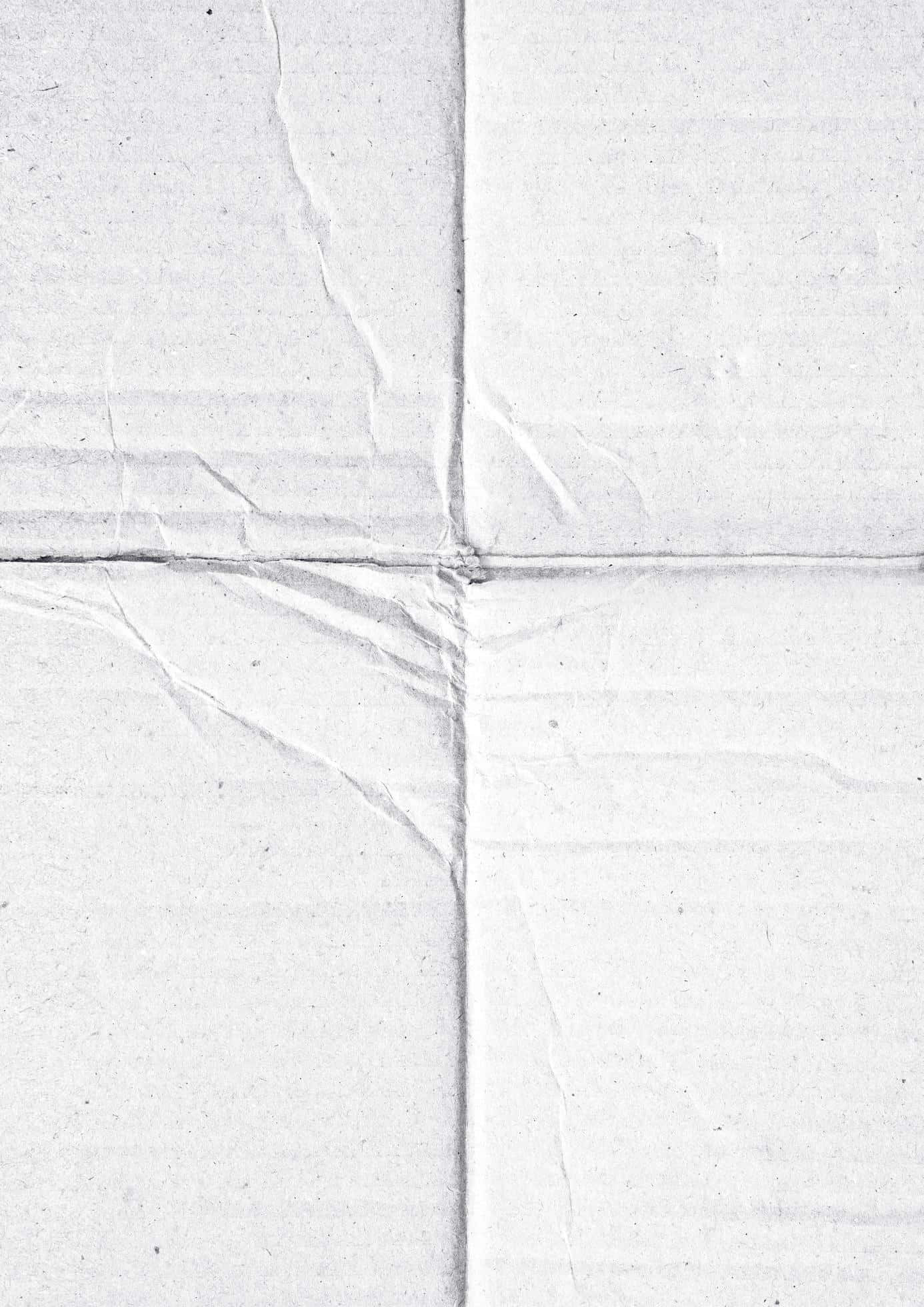 Blank White 桌布 壁紙 — 皺巴巴白紙的特寫，可見摺痕和紋理。