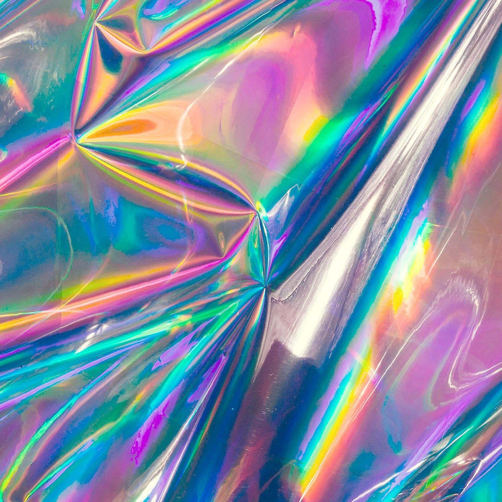 Hologram 桌布 壁紙 — 皺巴巴的全息箔特寫，反射出變幻幾何圖案中鮮豔的彩虹色彩。