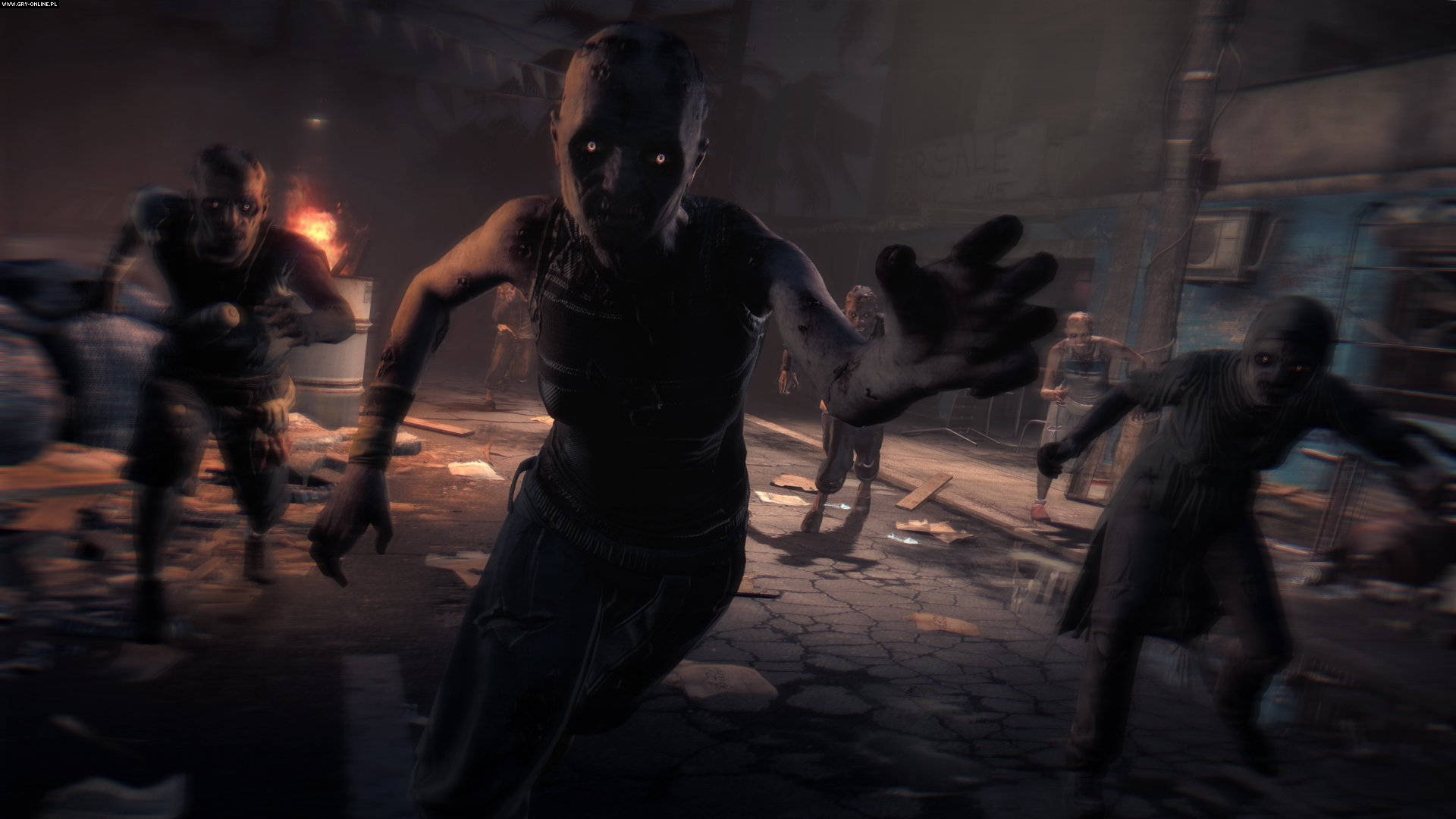 Dying Light 桌布 壁紙 — 眼睛發出紅光的殭屍在夜晚黑暗破敗的城市街道上湧向前。