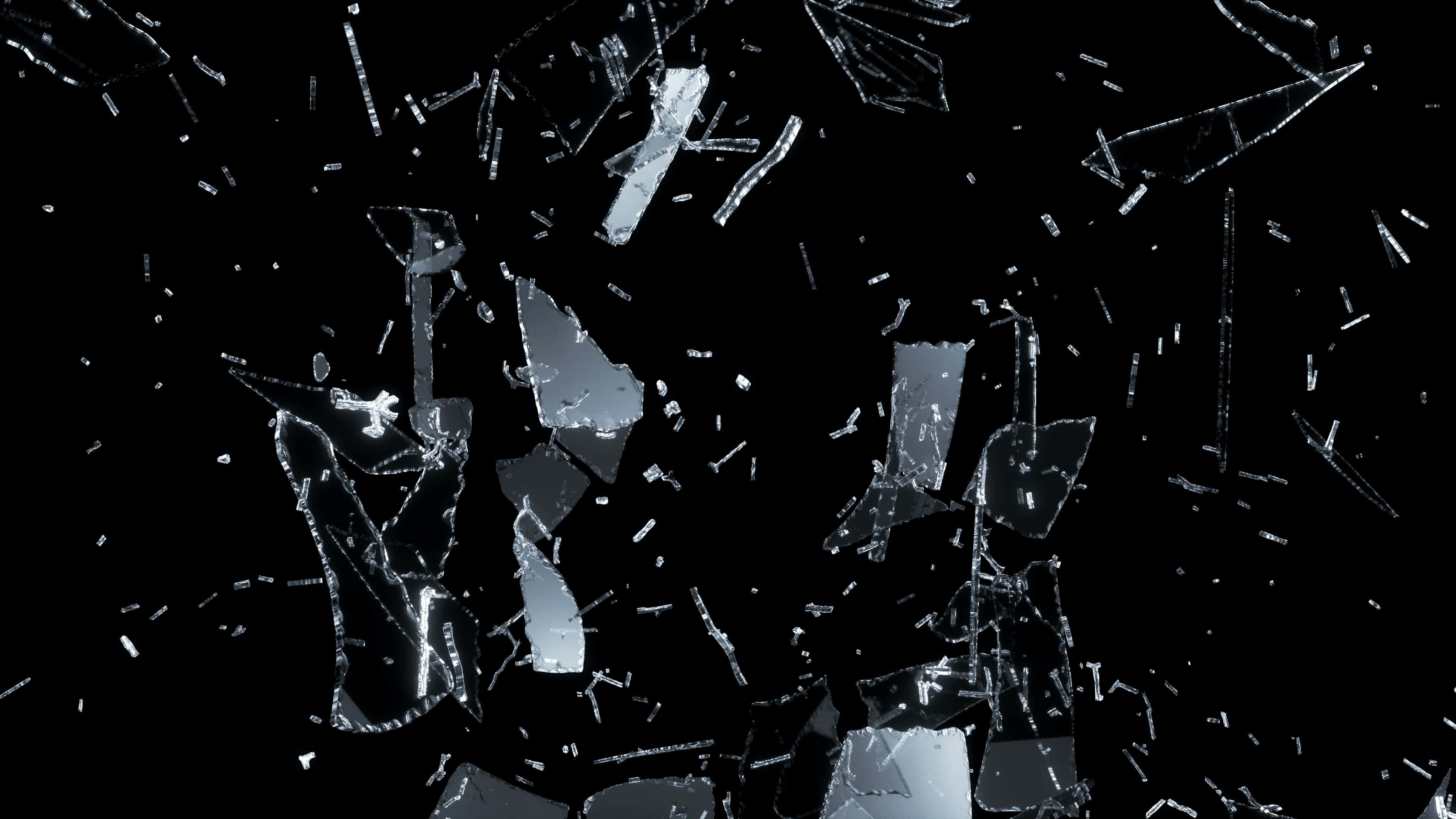 Fracture Glass 桌布 壁紙 — 破碎的玻璃碎片在純黑色背景上漂浮，形成尖銳幾何碎片的動態爆炸效果。