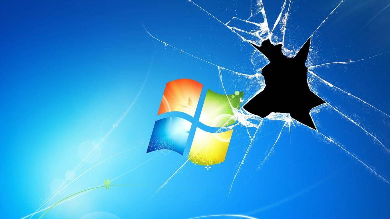 Screen 桌布 壁紙 — 碎裂玻璃效果在明亮的藍色漸變背景上，於Windows標誌上方顯現一個黑洞。