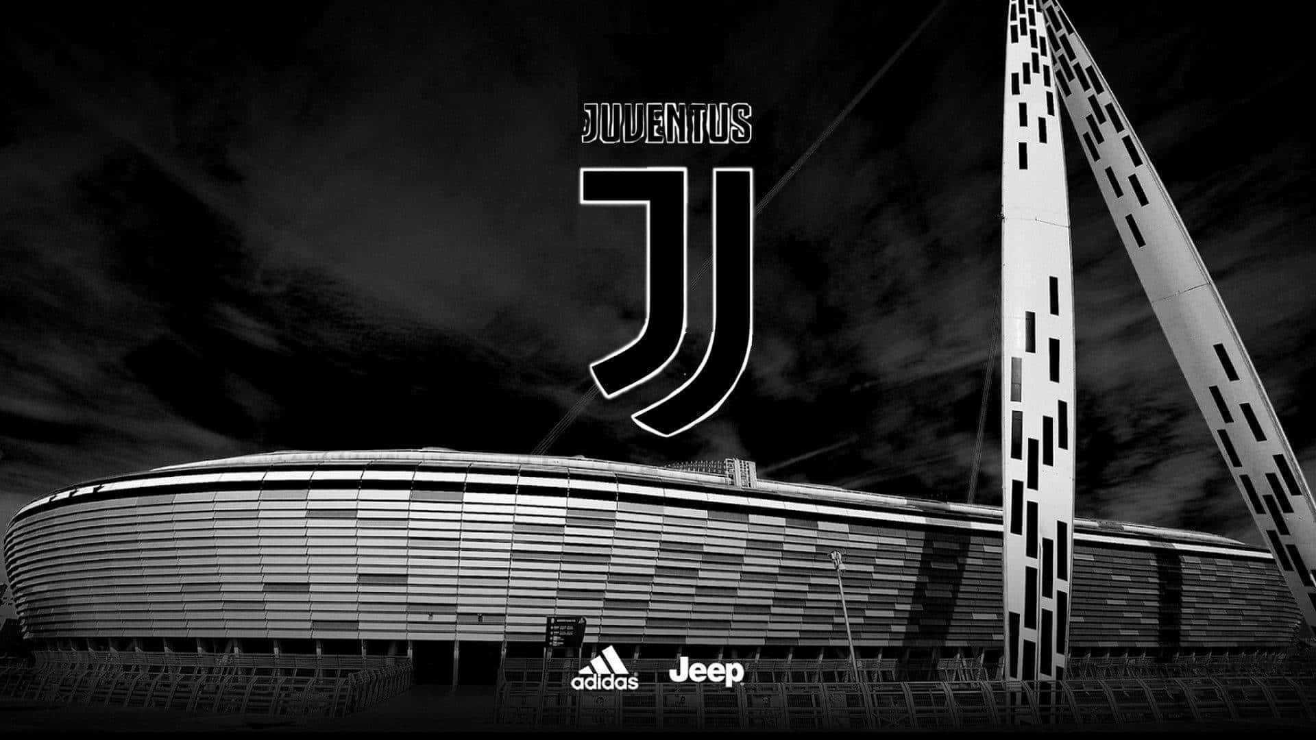 Juventus 桌布 壁紙 — 祖雲達斯球場的黑白景觀，以強烈標誌襯托戲劇性的多雲天空。