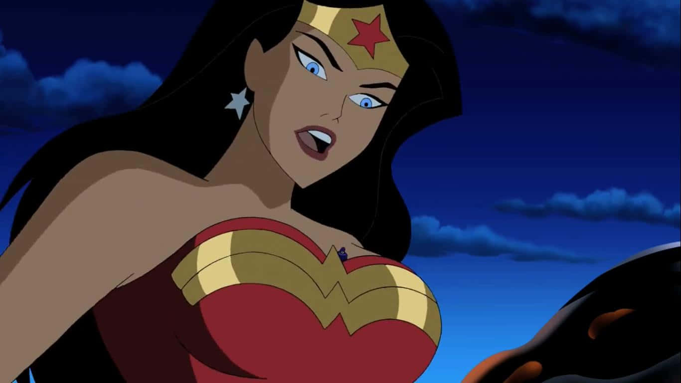 Justice League Unlimited 桌布 壁紙 — 神力女超人穿著標誌性的紅金藍戰衣，在陰暗多雲的夜空下，帶著堅定的表情站立。