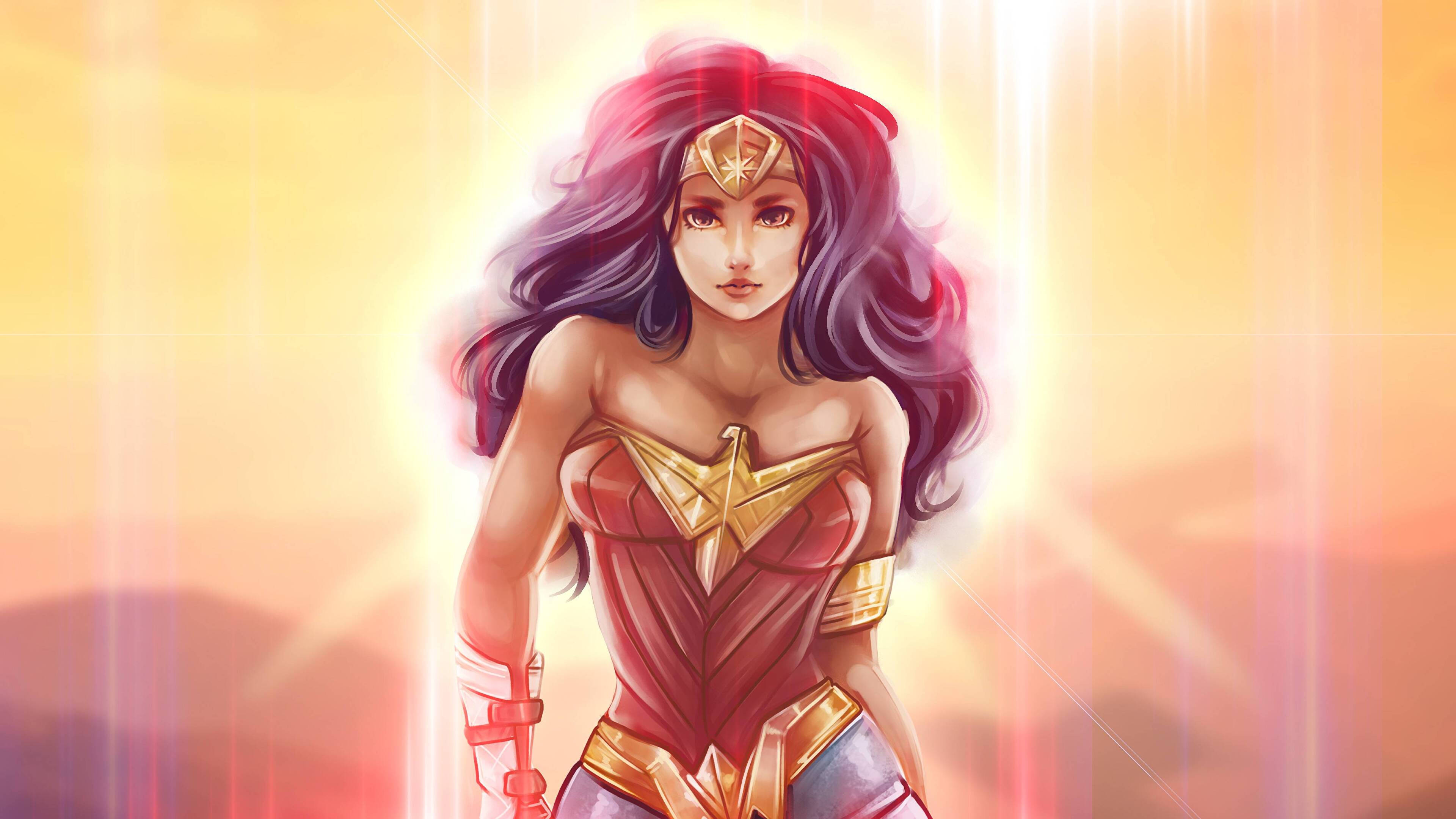 Wonder Woman 桌布 壁紙 — 神力女超人自信地站在閃耀的金色光環中，擁有飄逸的深色頭髮和醒目的紅金色服裝。