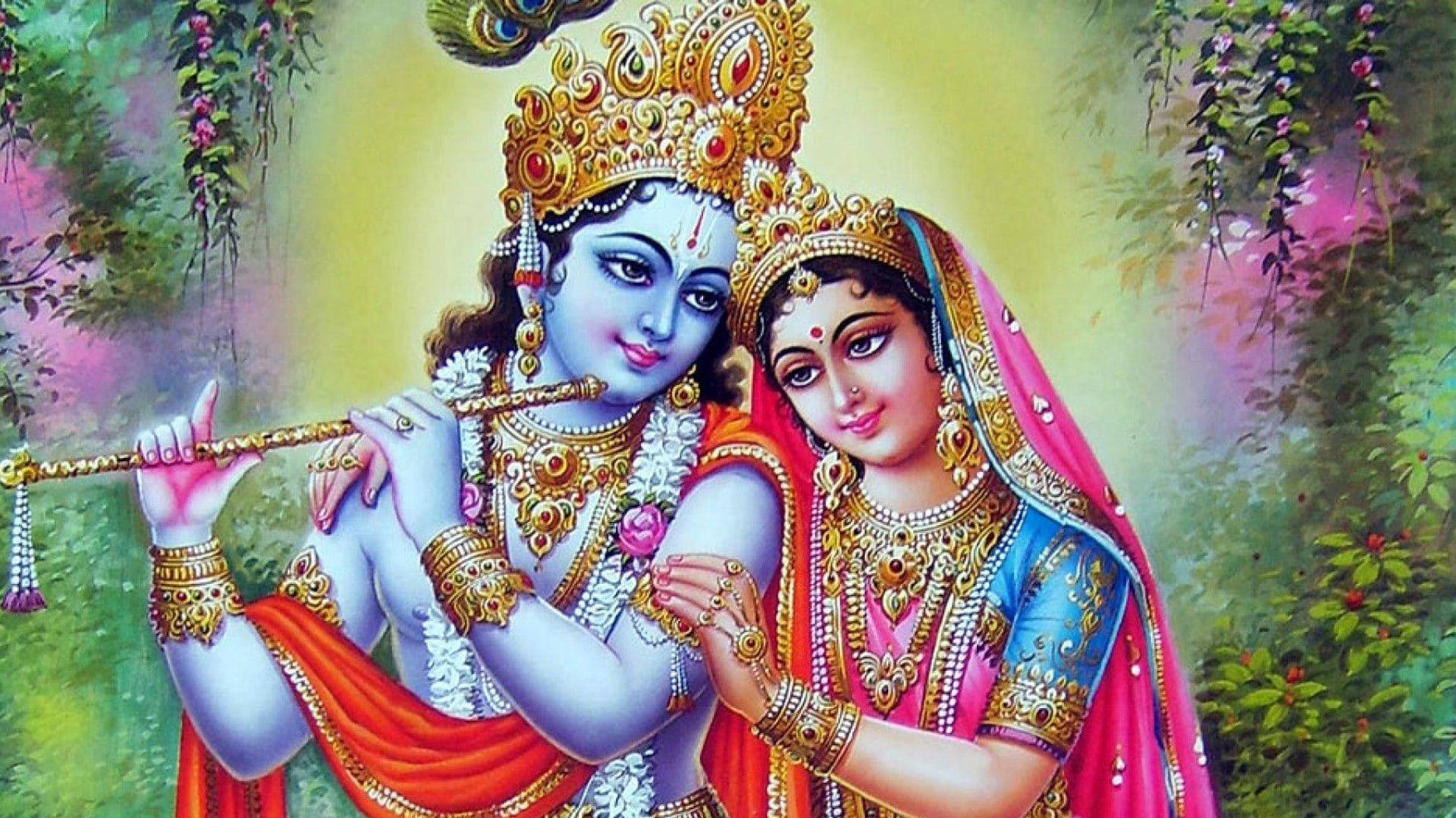 Krishna Desktop 桌布 壁紙 — 神聖情侶克里希納和拉妲在茂盛的花藤中擁抱，背景是燦爛的金色天空。