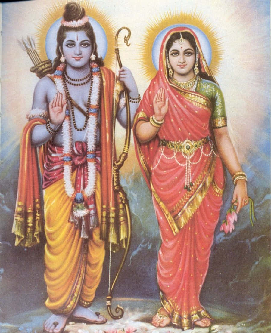 Hindu God 桌布 壁紙 — 神聖的印度教神祇濕婆和帕爾瓦蒂並肩而立，身著鮮豔的傳統服飾，頭後有光環。