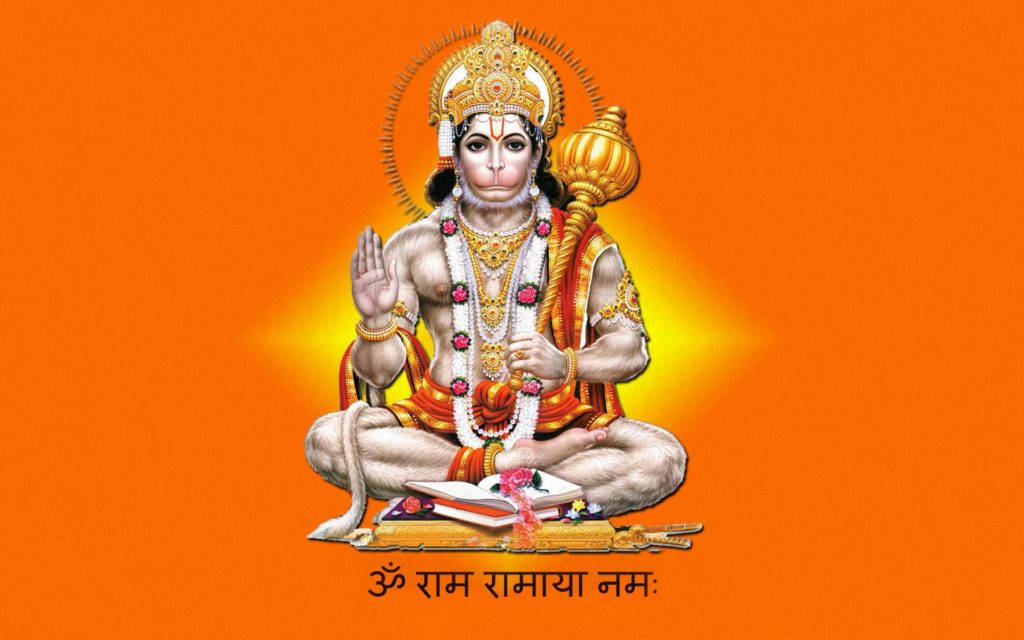 jai shri ram 桌布 壁紙 — 神聖的猴神哈努曼盤腿坐在橙色背景上，手持狼牙棒並做出祝福手勢。