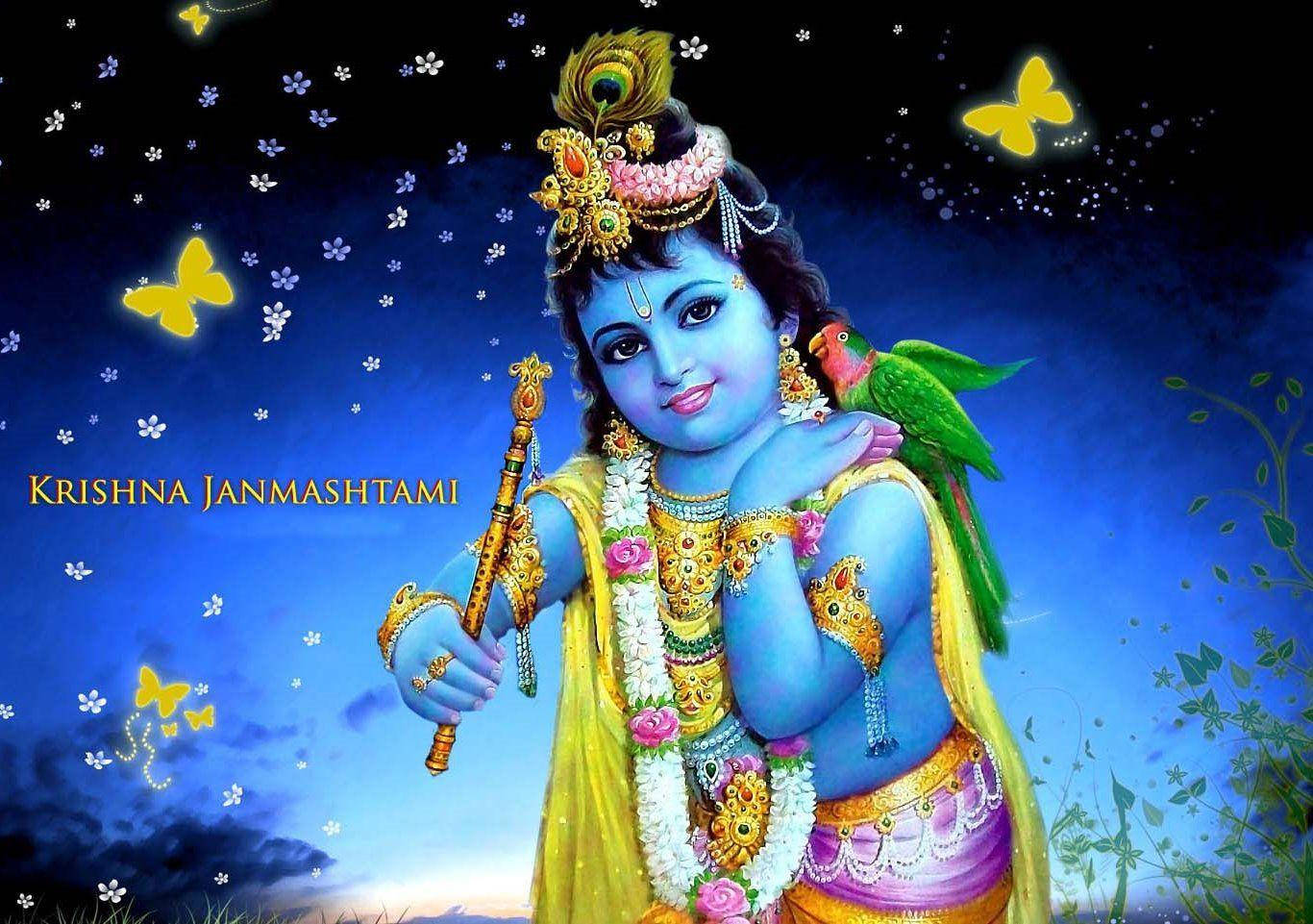 krishna bhagwan 桌布 壁紙 — 神聖的藍皮膚克里希納，飾以金色珠寶，手持長笛，一隻綠色鸚鵡棲息在他的肩膀上，背景是繁星點點的夜空和發光的蝴蝶。