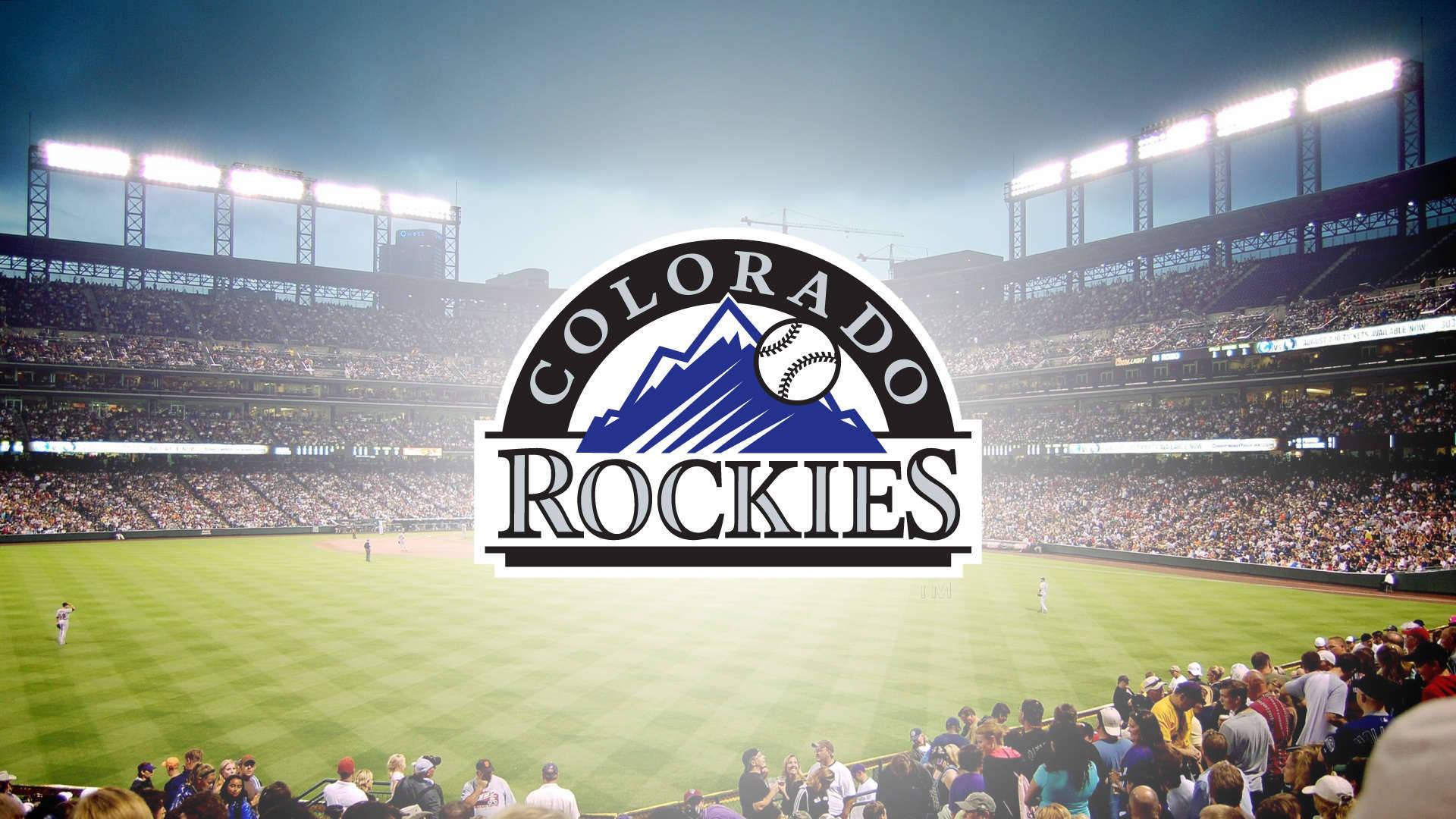 Rockies 桌布 壁紙 — 科羅拉多洛磯隊棒球場在黃昏的明亮燈光下擠滿了球迷。