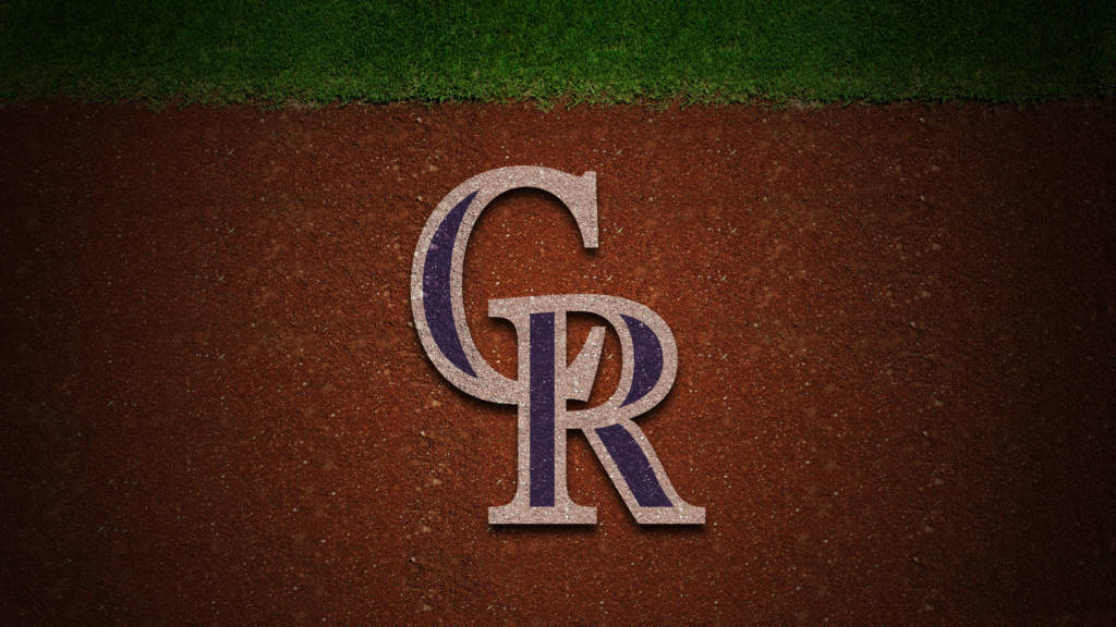 Rockies 桌布 壁紙 — 科羅拉多洛磯隊標誌嵌入棕色泥土中，上方有綠色草地。