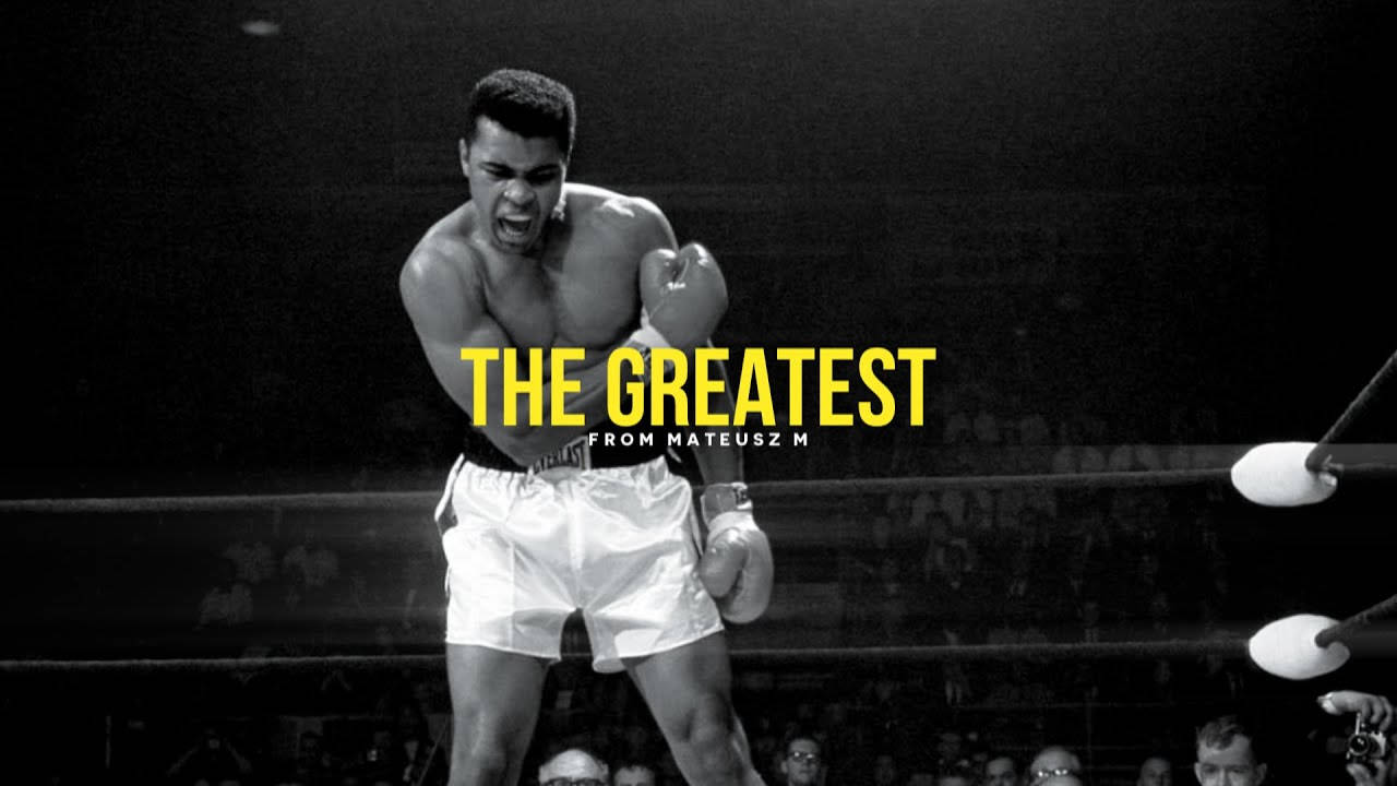 Muhammad 桌布 壁紙 — 穆罕默德·阿里在拳擊台上咆哮勝利，帶有「THE GREATEST」文字疊加。