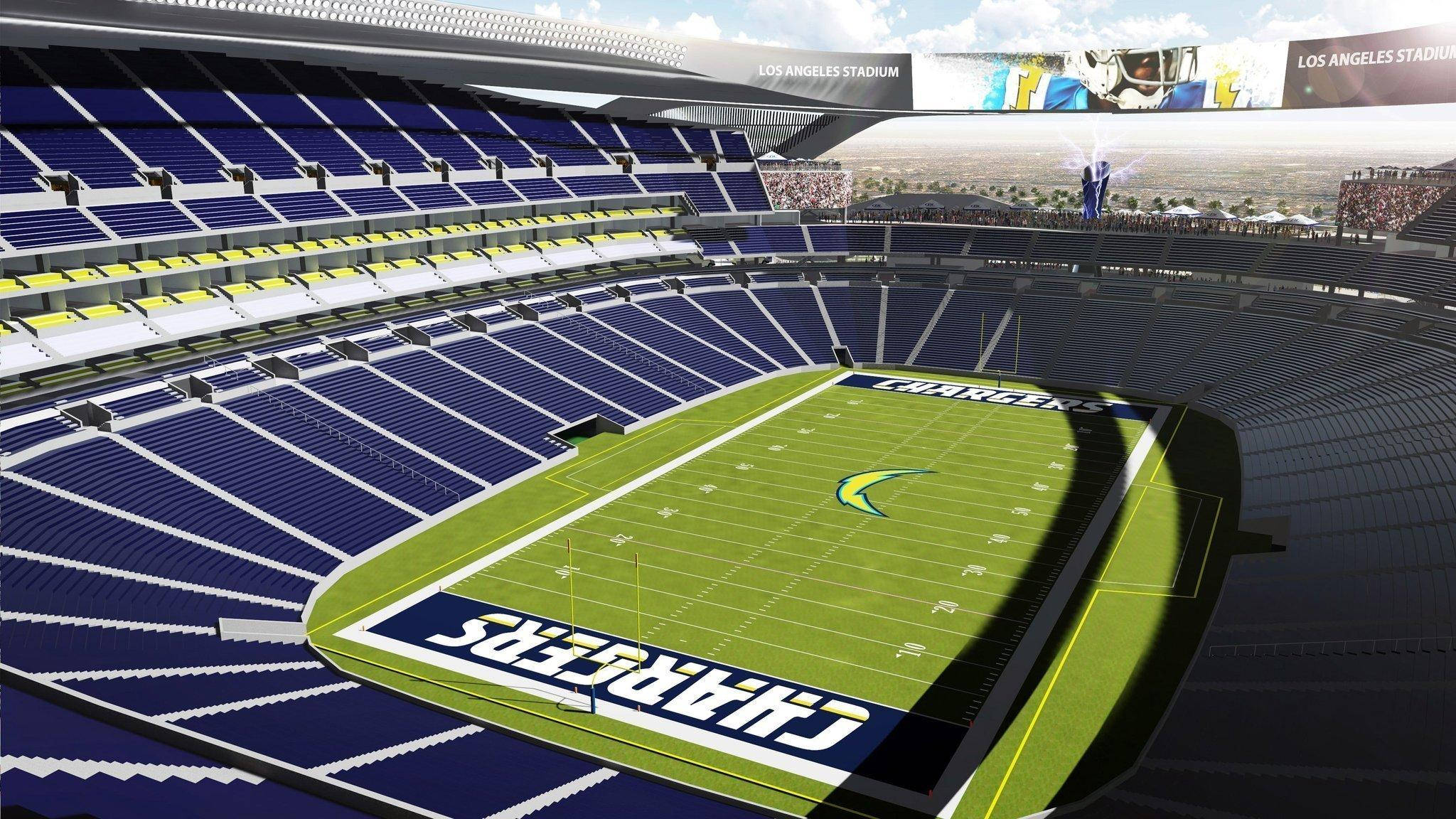 Stadium 桌布 壁紙 — 空蕩蕩的洛杉磯體育場的鳥瞰圖，藍色和黃色的座位環繞著充滿活力的綠色電光隊美式足球場。