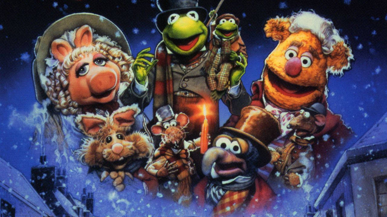 A 桌布 壁紙 — 穿著冬季外套和帽子的Muppet角色在雪花飄落的雪夜天空中歡樂地聚集。