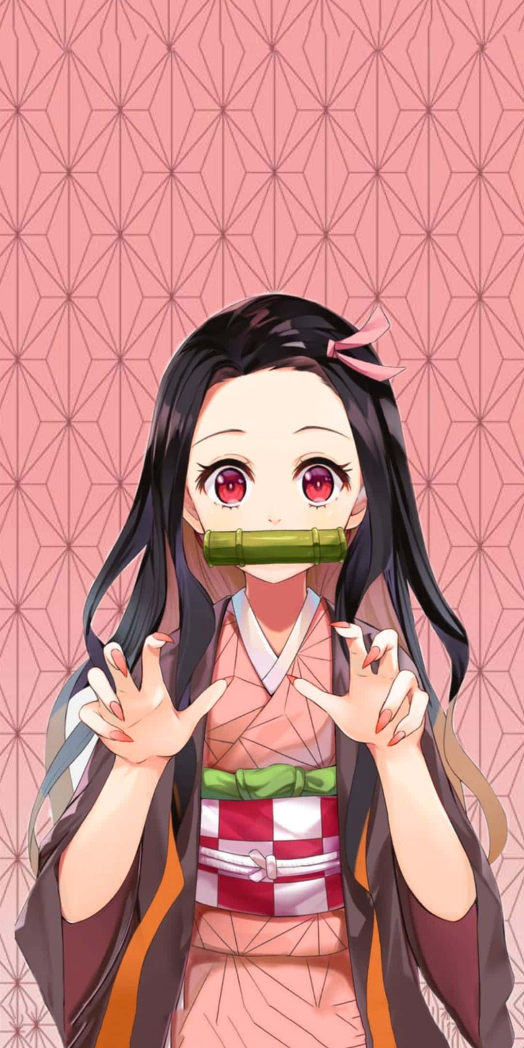 Cool Nezuko 桌布 壁紙 — 穿著粉紅色和服、戴著竹製口塞、紅眼睛的動漫女孩，背景為幾何粉紅色。