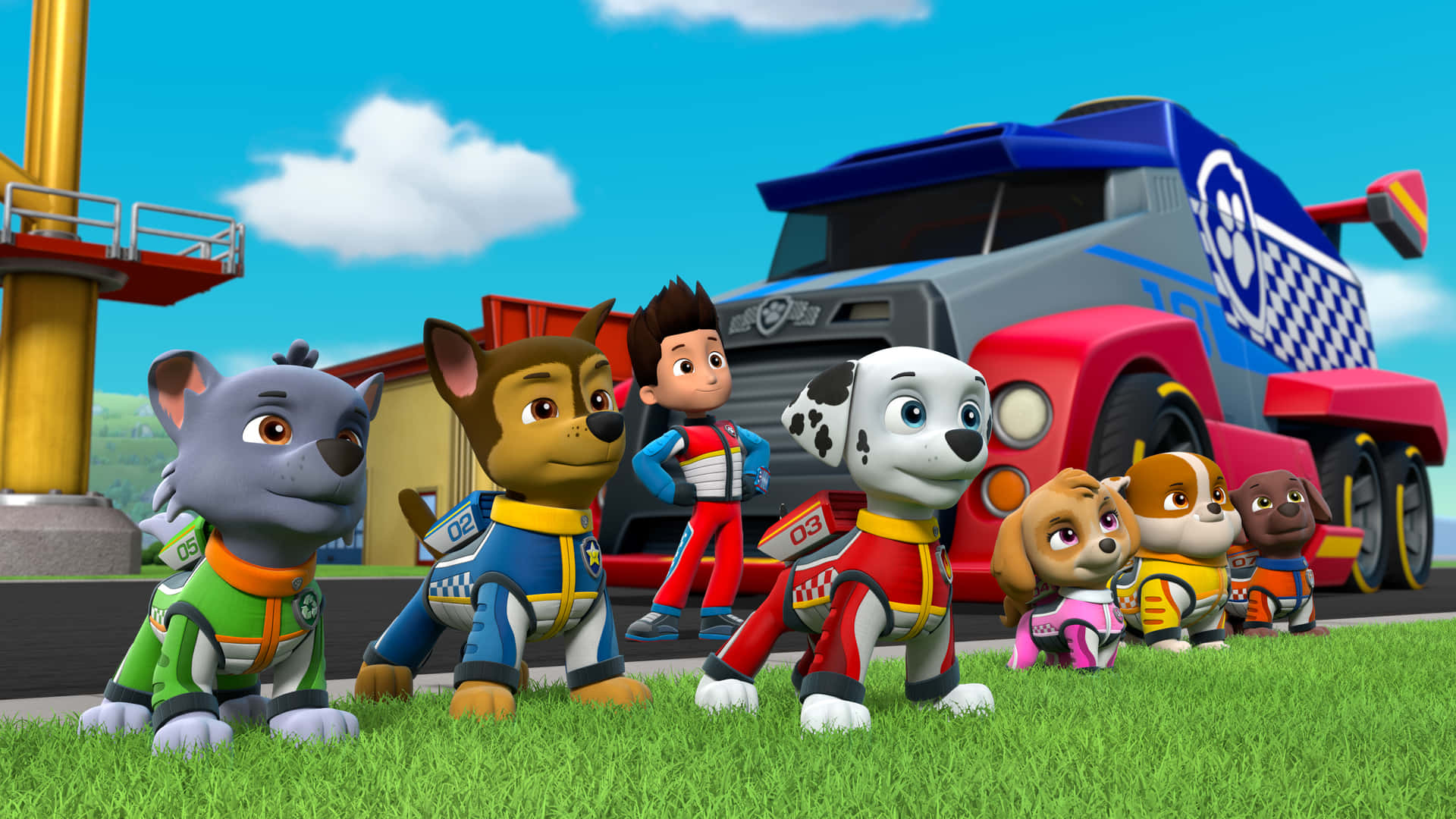 穿著救援裝備的Paw Patrol角色站在草地上，靠近一輛卡車。 — 汪汪隊立大功 GIF 壁紙