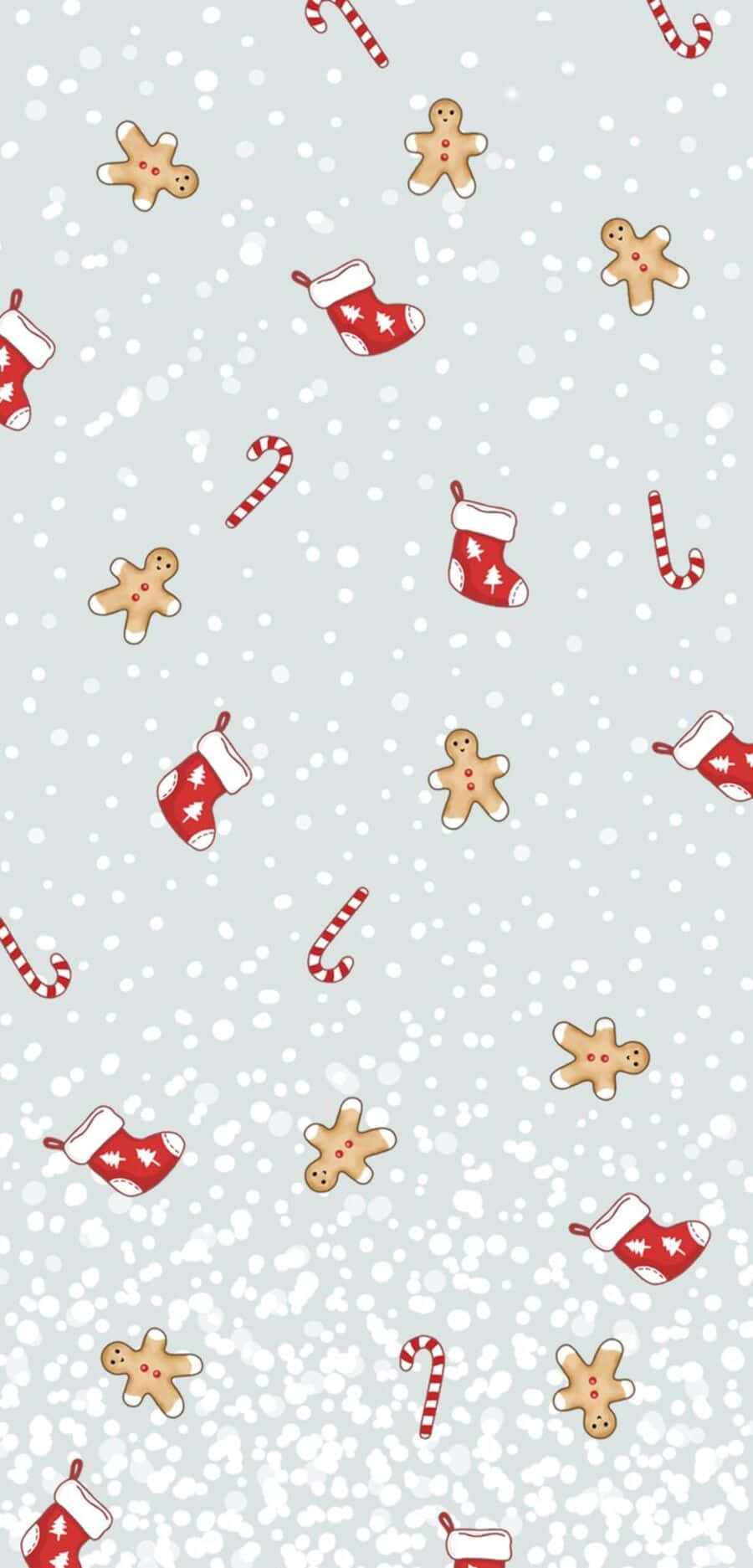 Cute Winter Aesthetic 桌布 壁紙 — 節日壁紙，上面散落著薑餅人、拐杖糖和紅色長襪，背景是帶有雪花的淺灰色。