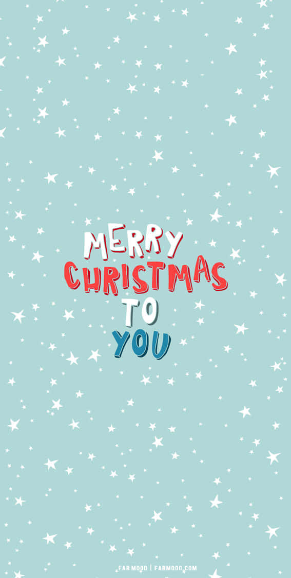 Cute Simple Christmas 桌布 壁紙 — 節日淺藍色桌布，帶有白色星星和色彩繽紛的「Merry Christmas to You」文字。