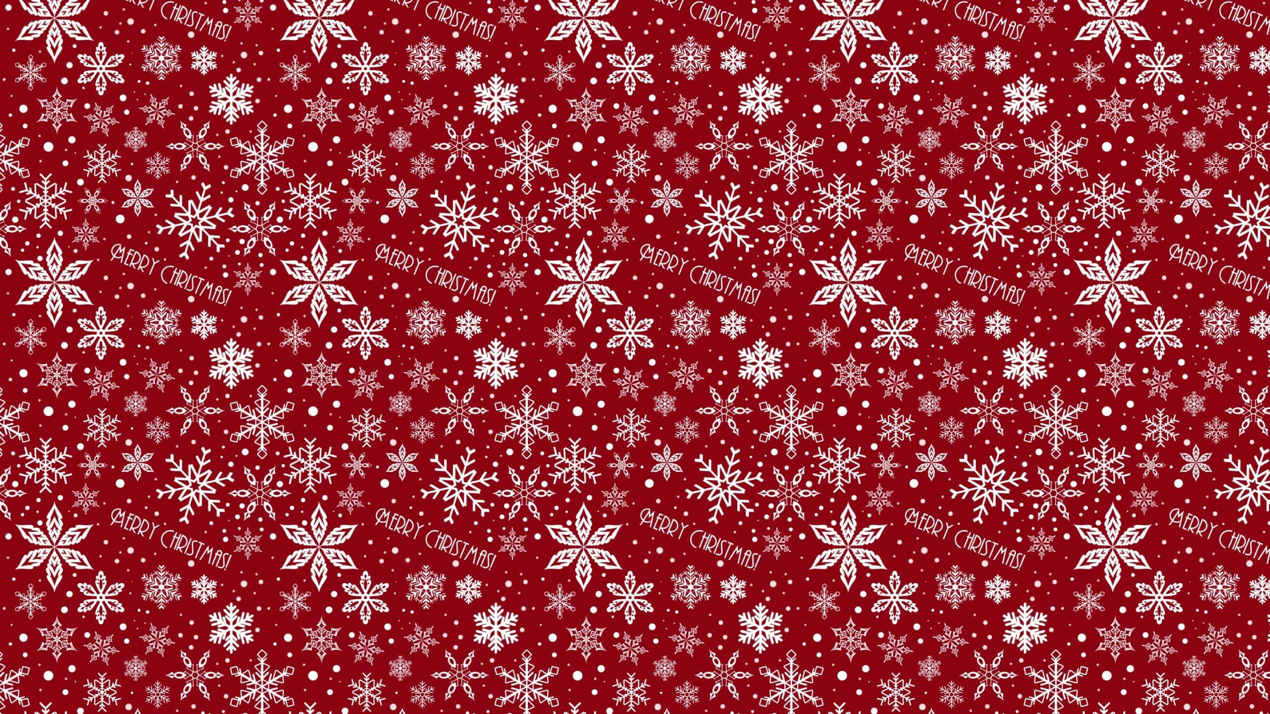 桌布 壁紙 — 節日紅色壁紙，帶有白色雪花和散落的「MERRY CHRISTMAS」文字。