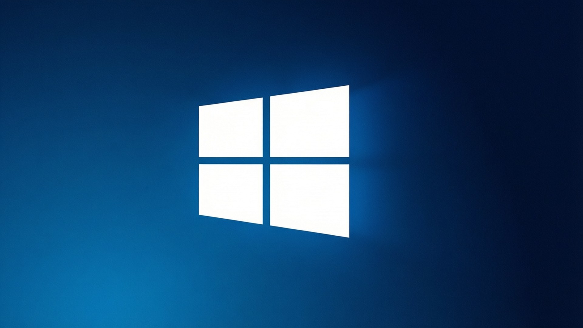 簡約Windows 10標誌 壁紙 — 一個發光的白色Windows標誌居中於漸變藍色背景上，後方散發出柔和的光線。
