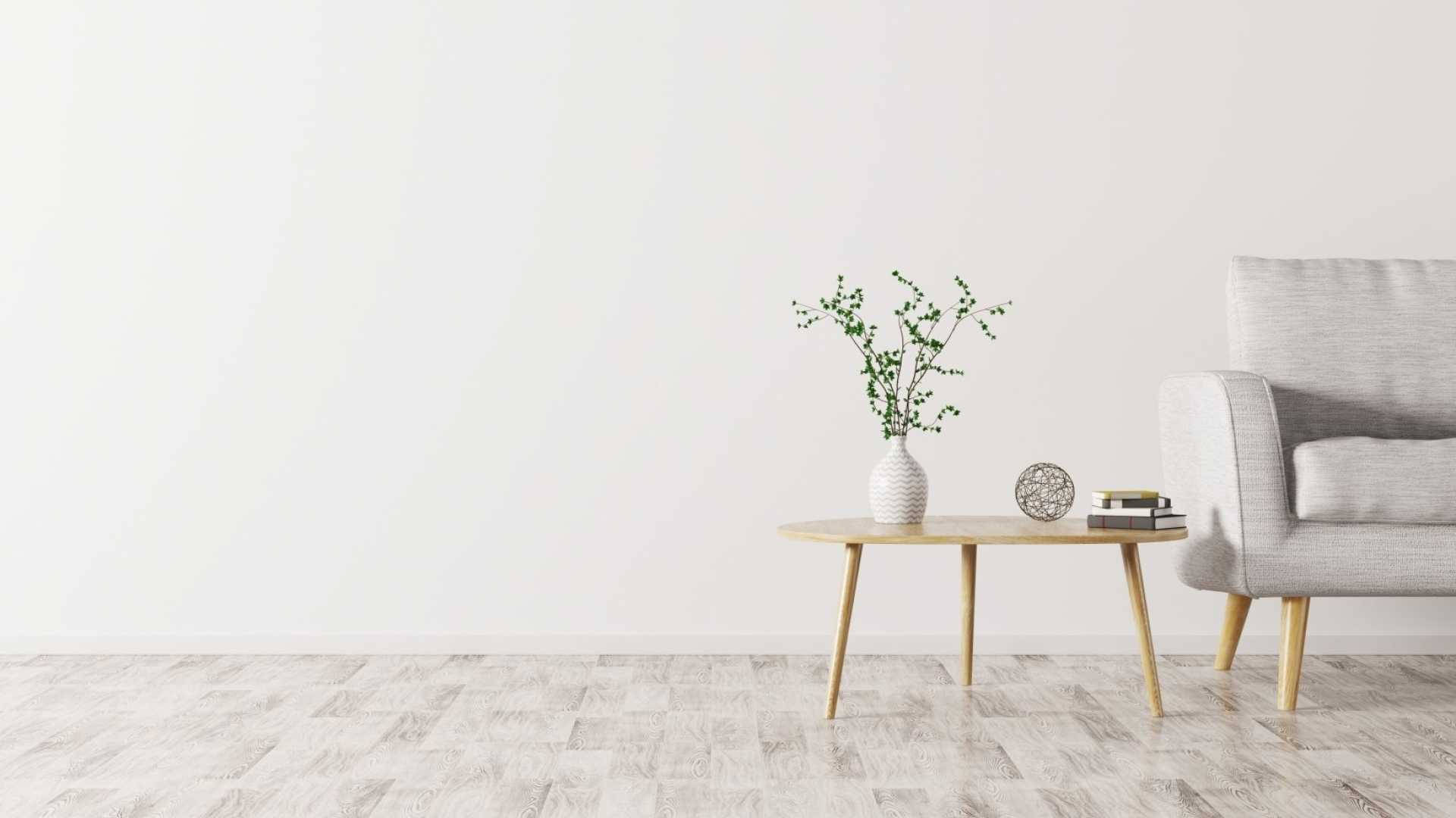 房屋 桌布 壁紙 — 簡約客廳角落，灰色扶手椅、木桌和綠色枝條花瓶，襯以白色牆壁。