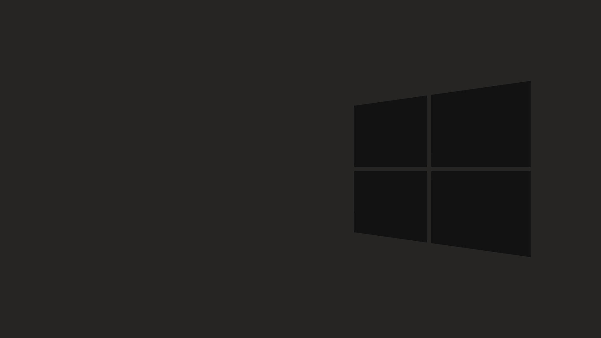 Dark Minimalist 桌布 壁紙 — 簡約深灰色壁紙，角落有微妙的Windows標誌剪影。