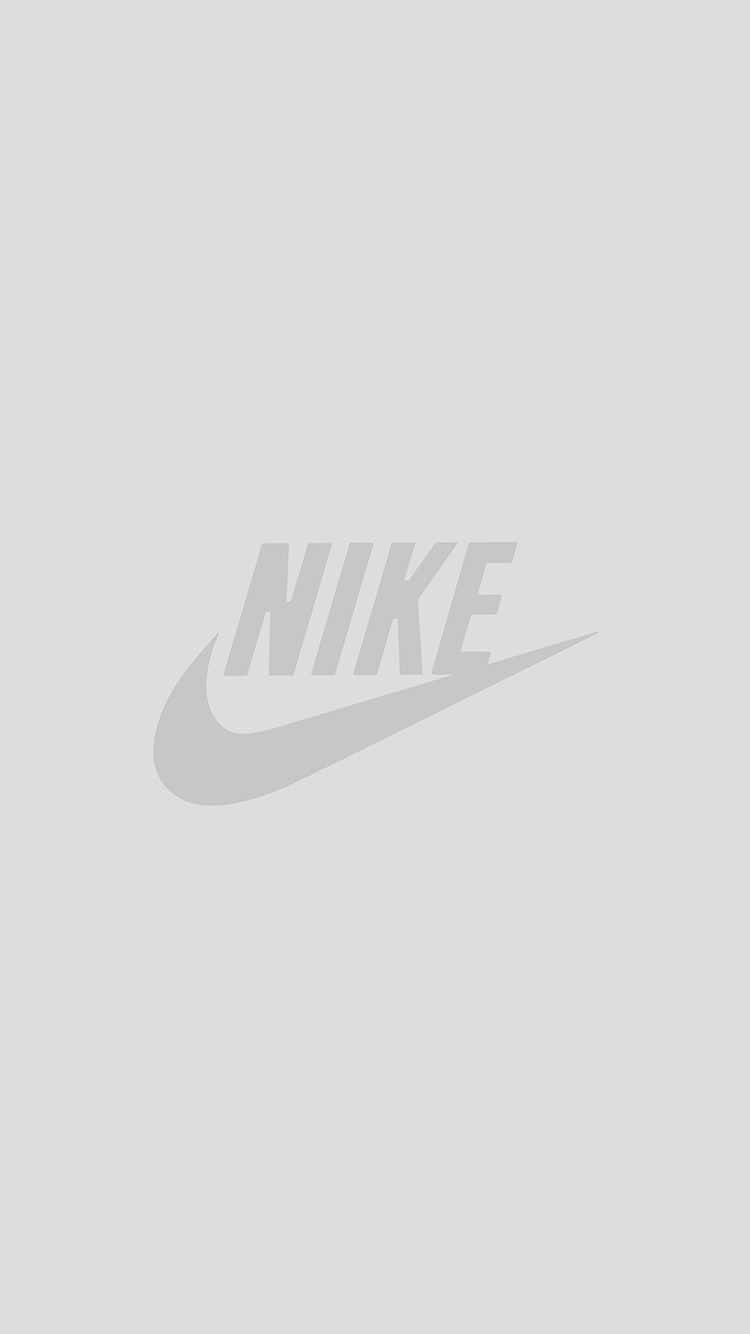 White iPhone 桌布 壁紙 — 簡約灰色Nike勾勾標誌，置於純淺灰色背景中央。