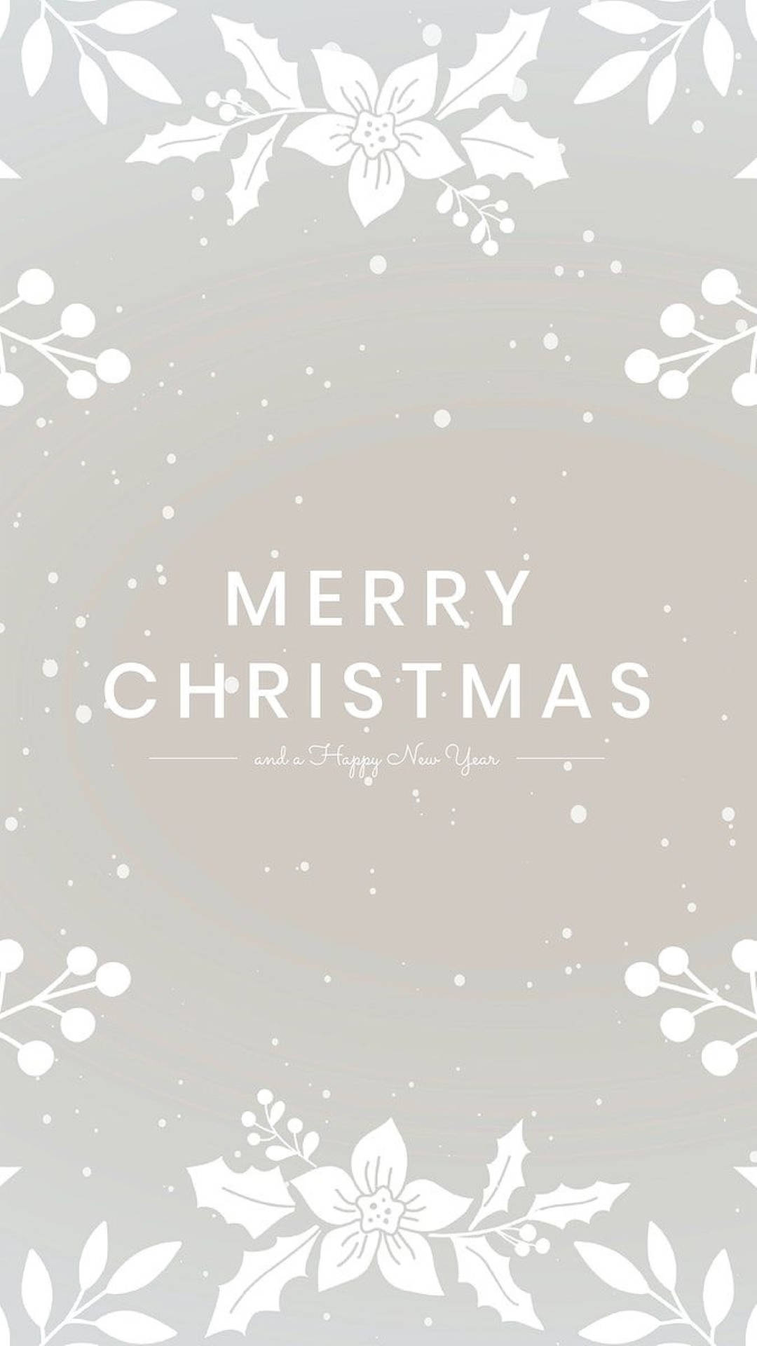 聖誕美學 桌布 壁紙 — 簡約灰色桌布，白色冬青和漿果圍繞中央的「MERRY CHRISTMAS」訊息。