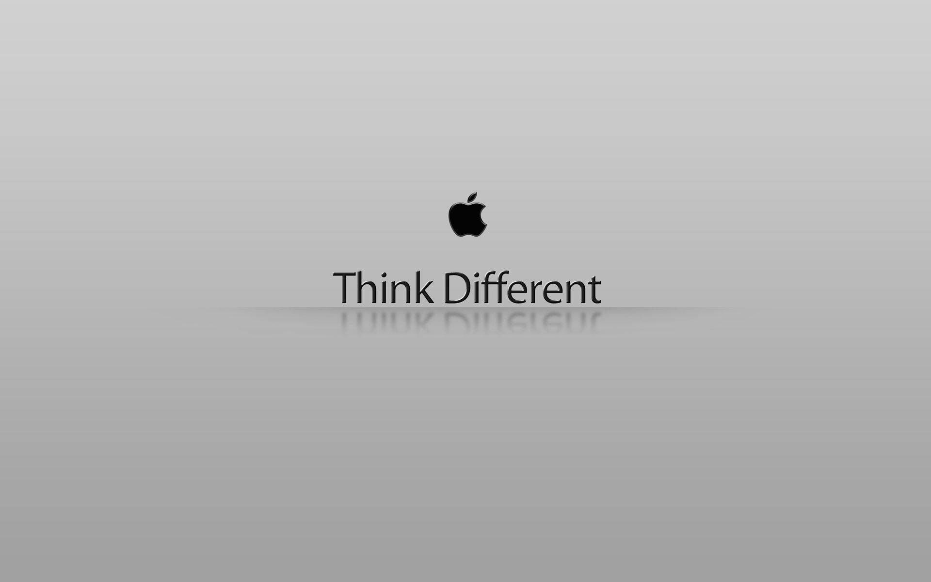 蘋果 桌布 壁紙 — 簡約灰色漸層背景，帶有黑色Apple標誌和「Think Different」文字，下方有微妙倒影。