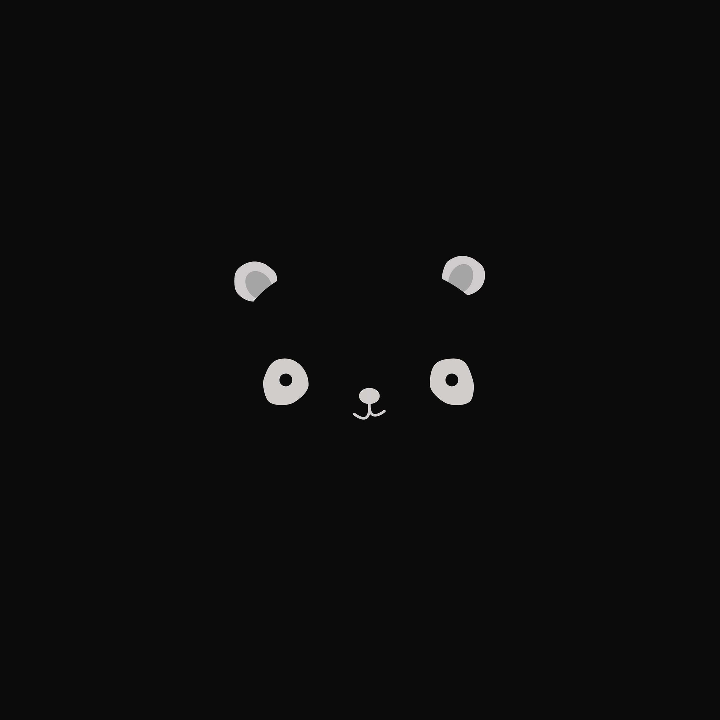 Cute iPad 桌布 壁紙 — 簡約灰色熊貓臉，帶有簡單的眼睛、耳朵和鼻子，居中在純黑色背景上。