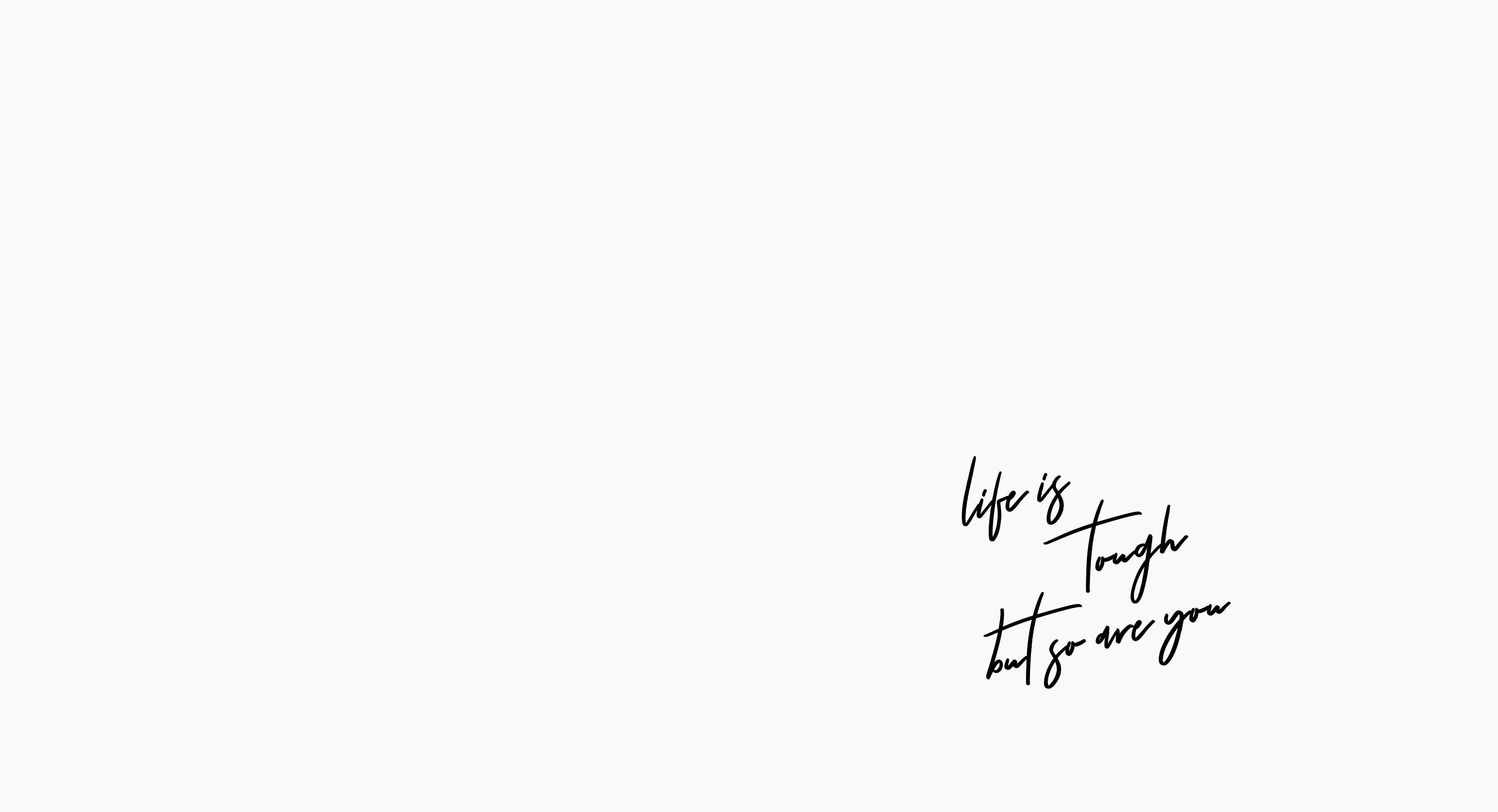 Motivational Aesthetic Desktop 桌布 壁紙 — 簡約白色背景，右下角有優雅的黑色草書文字寫著 life is tough but so are you。