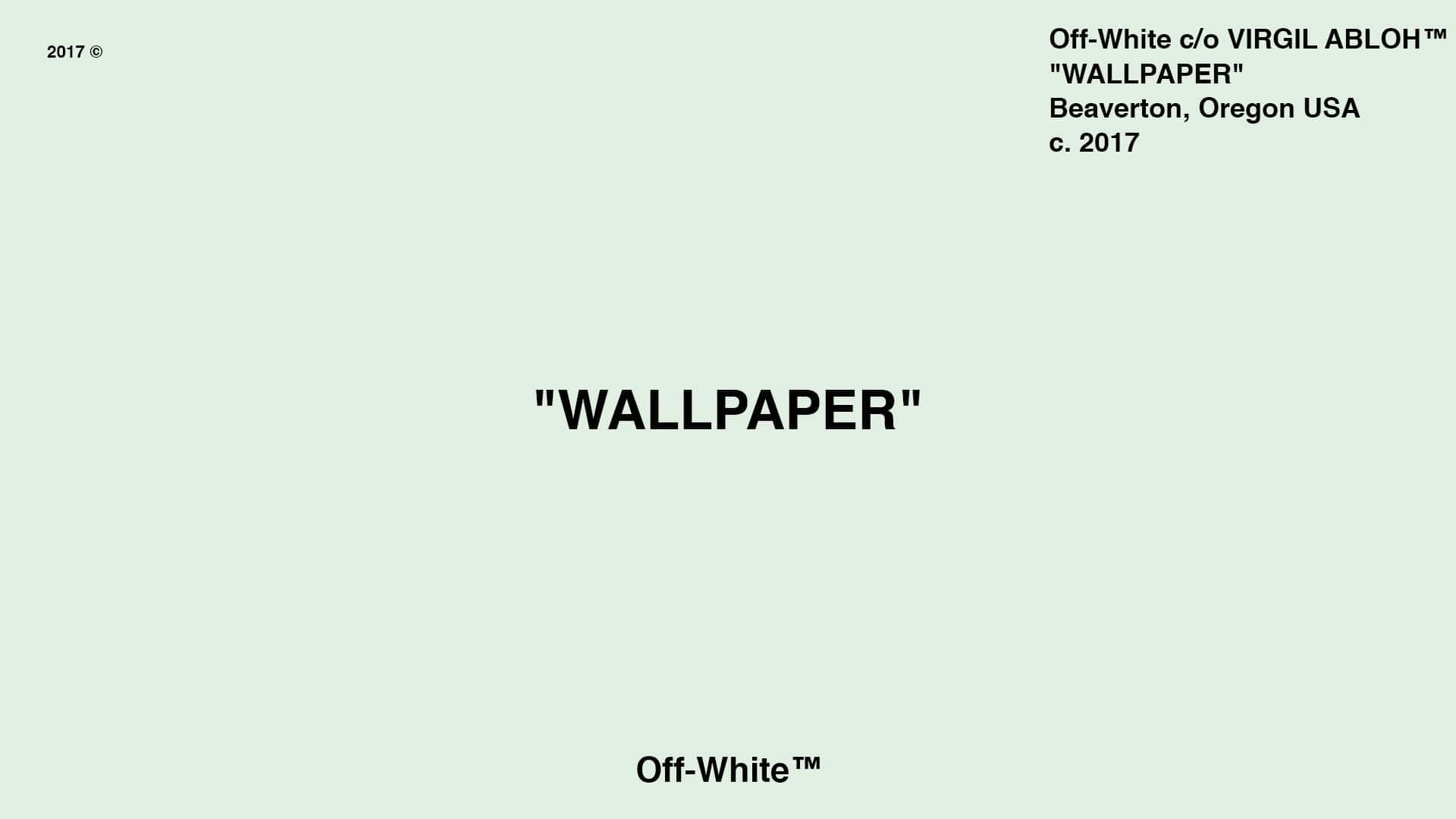 桌布 壁紙 — 簡約米白色桌布，上面有粗體黑色文字寫著 WALLPAPER 和品牌標誌。
