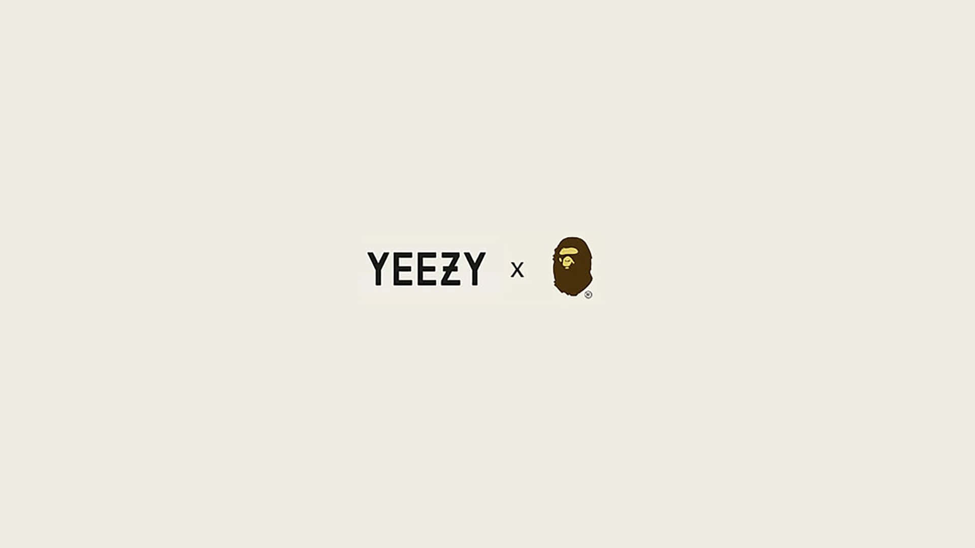 Bape 動態 桌布 壁紙 — 簡約米色背景，中央有粗體黑色YEEZY文字和棕色猿頭標誌。