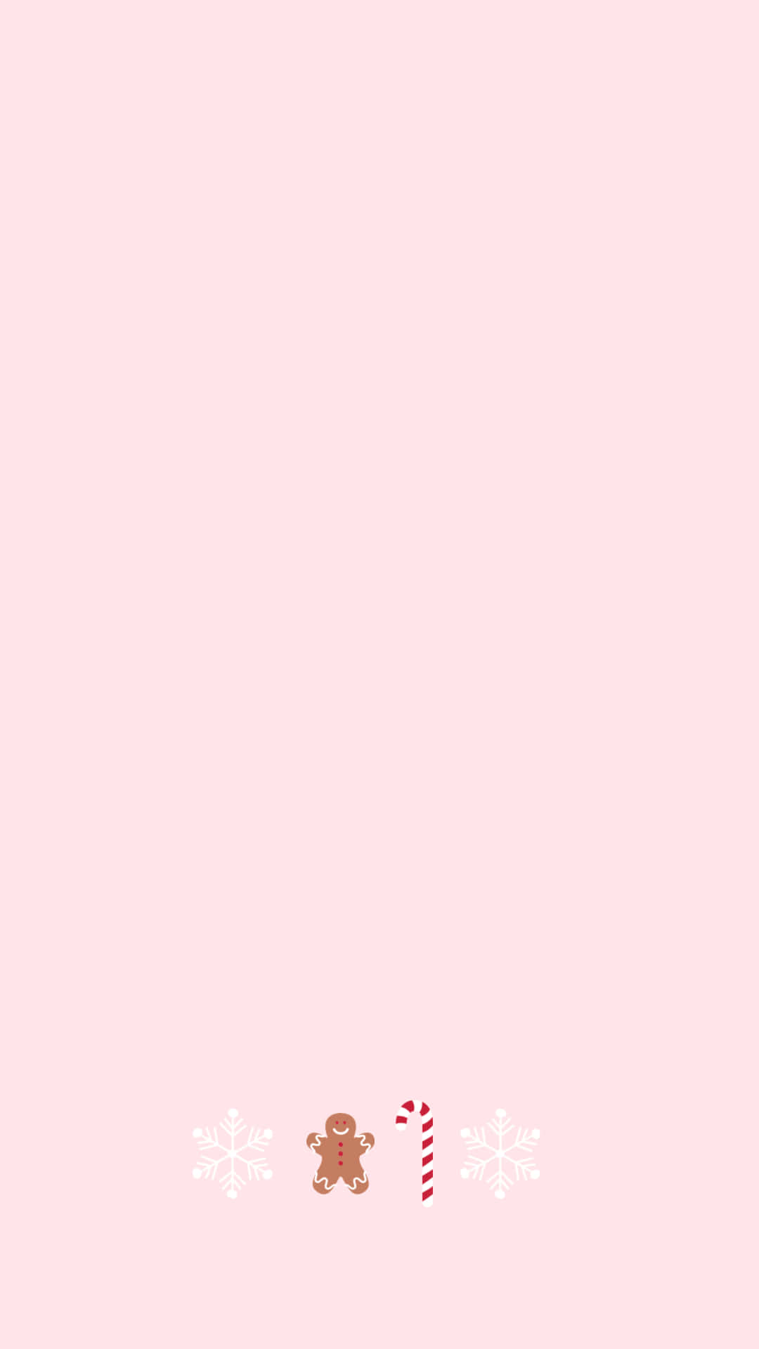 粉紅色背景，底部有薑餅人糖果手杖和雪花。 — 雪花 GIF 壁紙