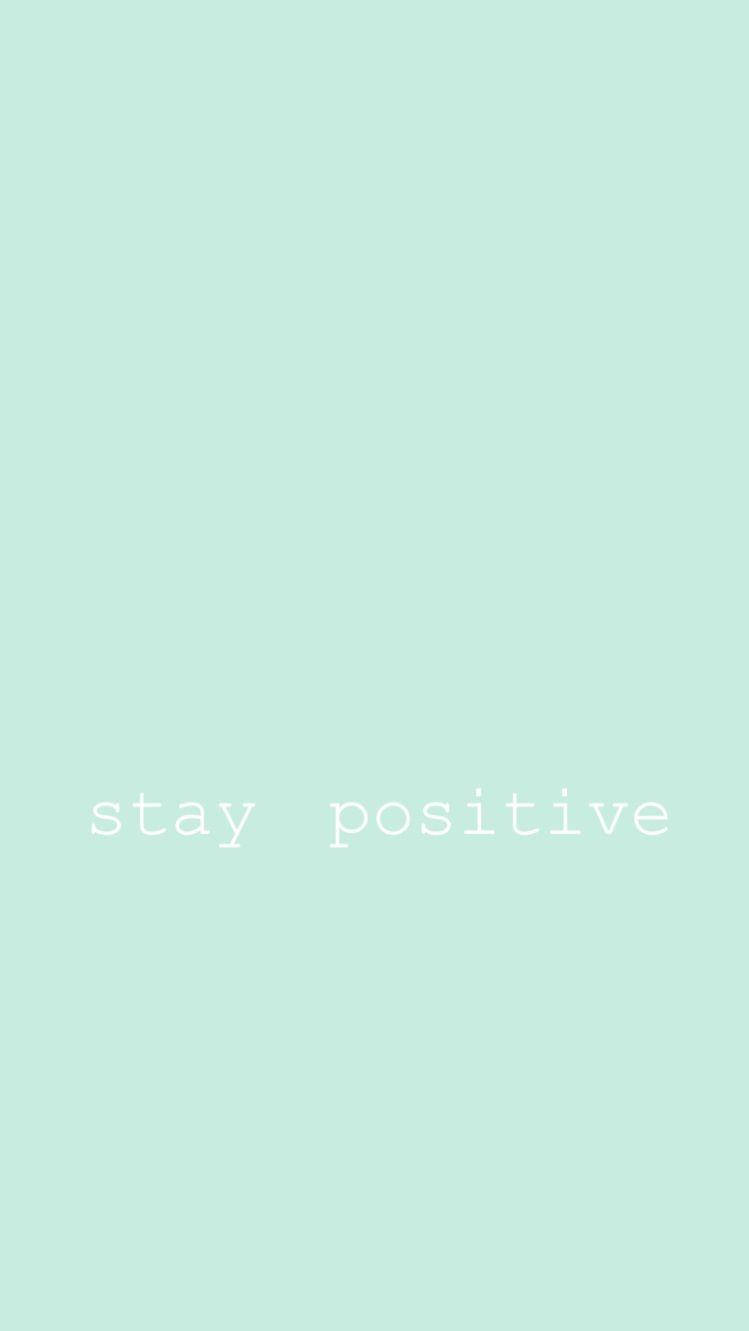 人像動態 桌布 壁紙 — 簡約薄荷綠色背景，中央有白色文字寫著 stay positive。